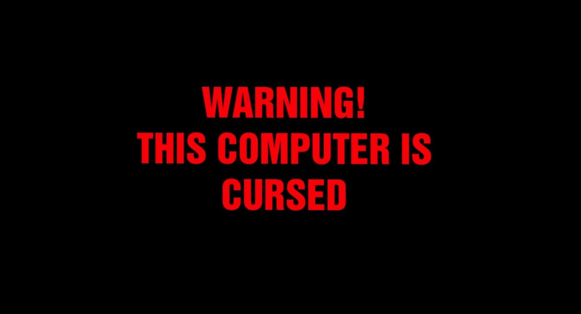 warning 桌布 壁紙 — 粗體紅色文字警告電腦被詛咒，背景為 stark 黑色。