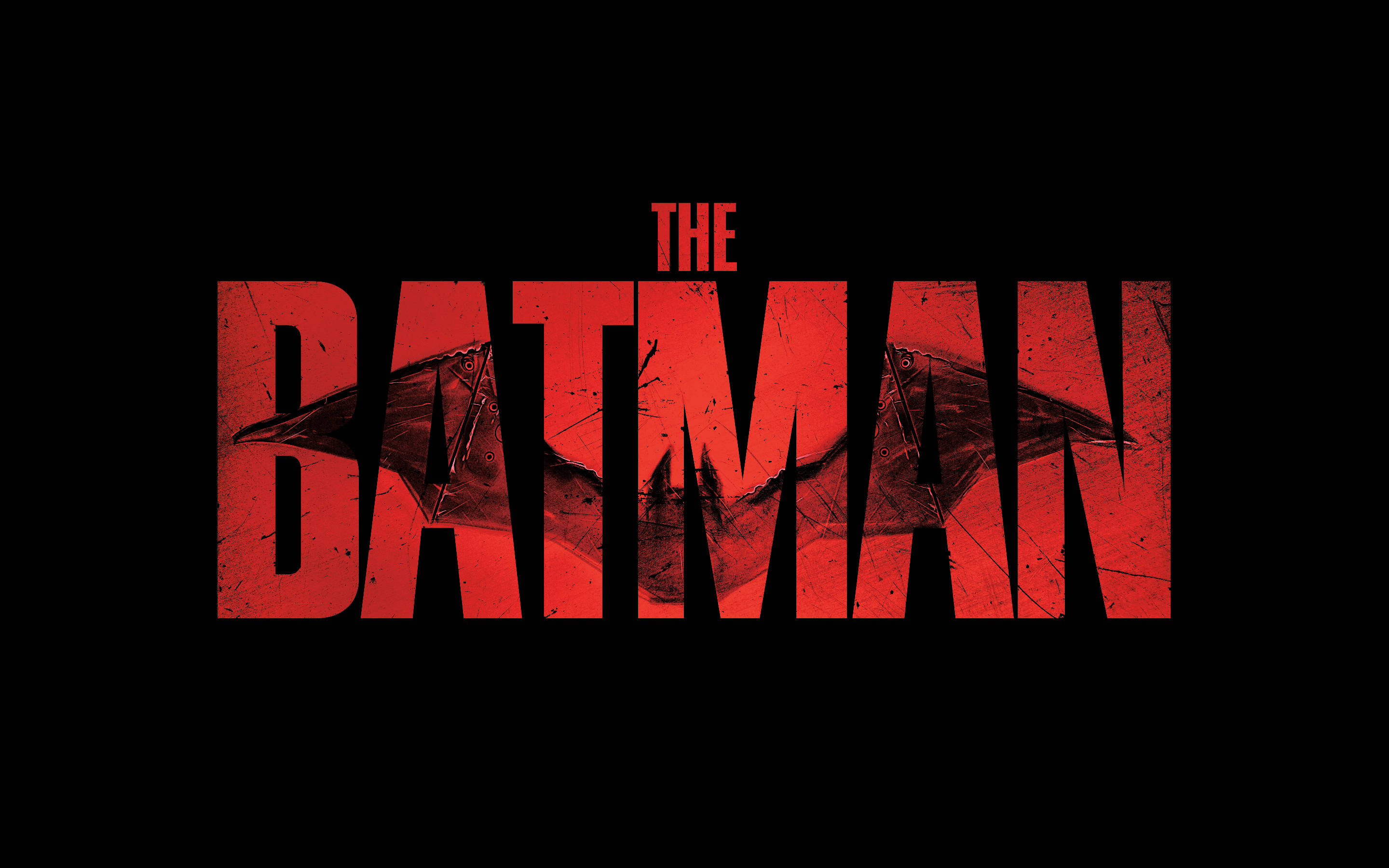 Dc 桌布 壁紙 — 粗體紅色磨損文字拼出「THE BATMAN」，字母內有蝙蝠剪影，背景為黑色。