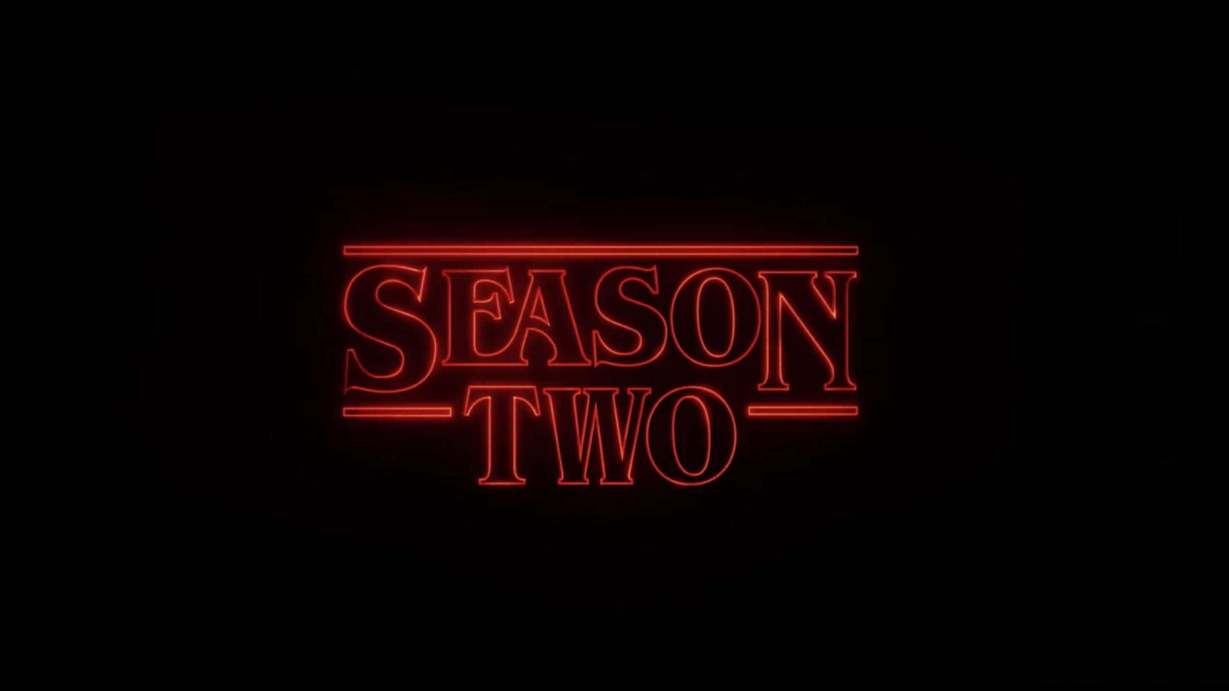 怪奇物語 桌布 壁紙 — 粗體紅色霓虹燈文字「SEASON TWO」在漆黑背景上發光。