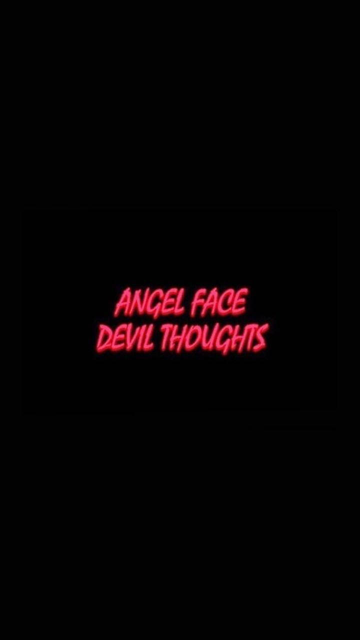 iPhone baddie 桌布 壁紙 — 粗體紅色霓虹燈文字在純黑色背景上顯示 angel face devil thoughts。