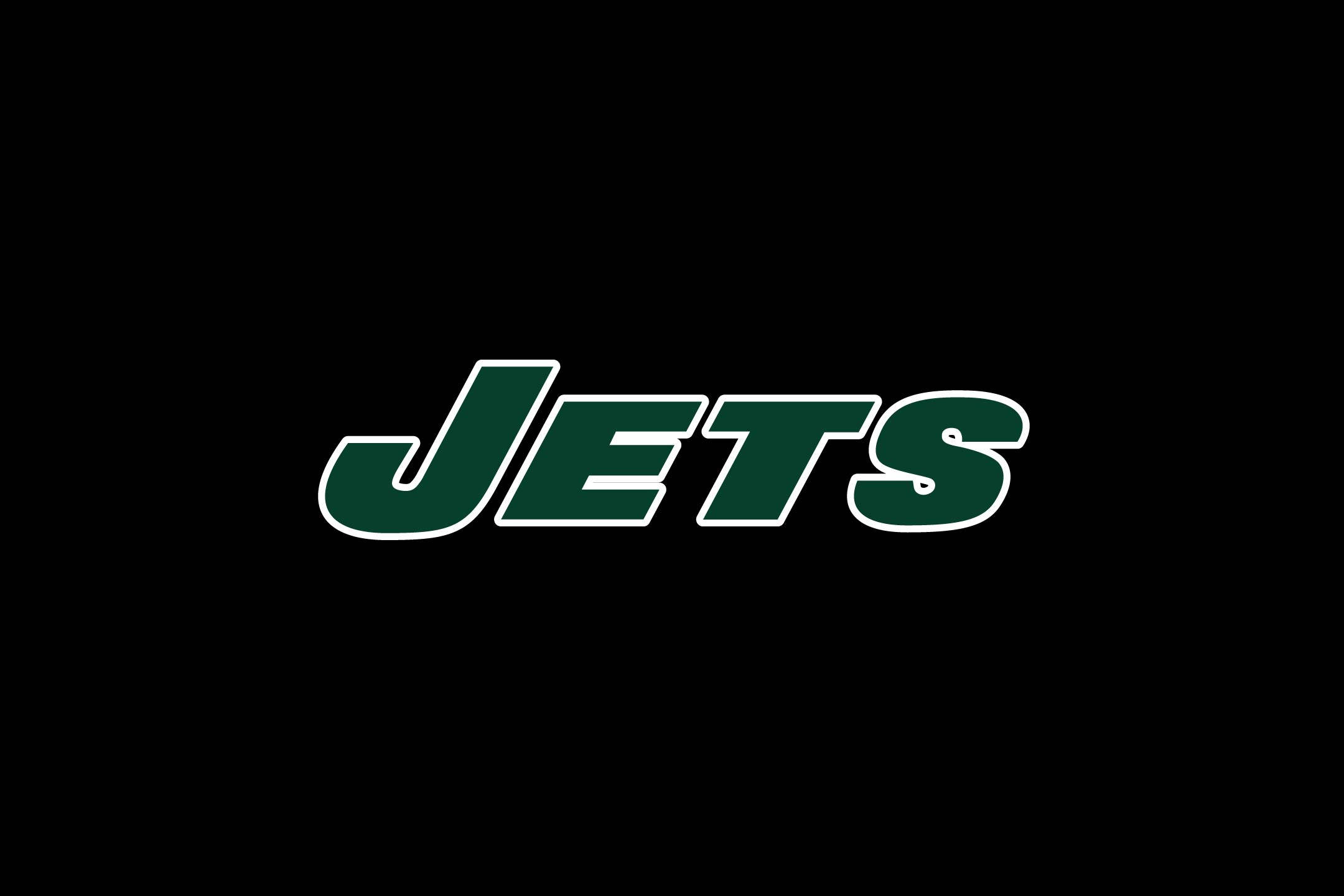 運動 桌布 壁紙 — 粗體綠色輪廓的「JETS」標誌居中於純黑色背景上。