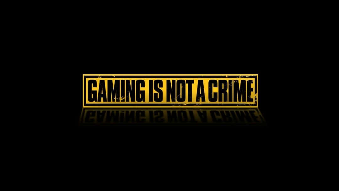 Aesthetic Gaming 桌布 壁紙 — 粗體黃色文字在黑色背景上宣示遊戲不是犯罪，並帶有鏡面反射效果。