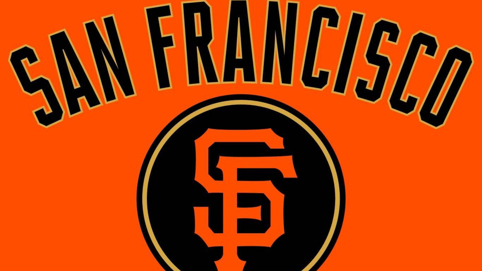 Giants 桌布 壁紙 — 粗體黑色 'SAN FRANCISCO' 文字拱起在一個帶有橙色 'SF' 縮寫的圓形標誌上，背景為鮮豔的橙色。