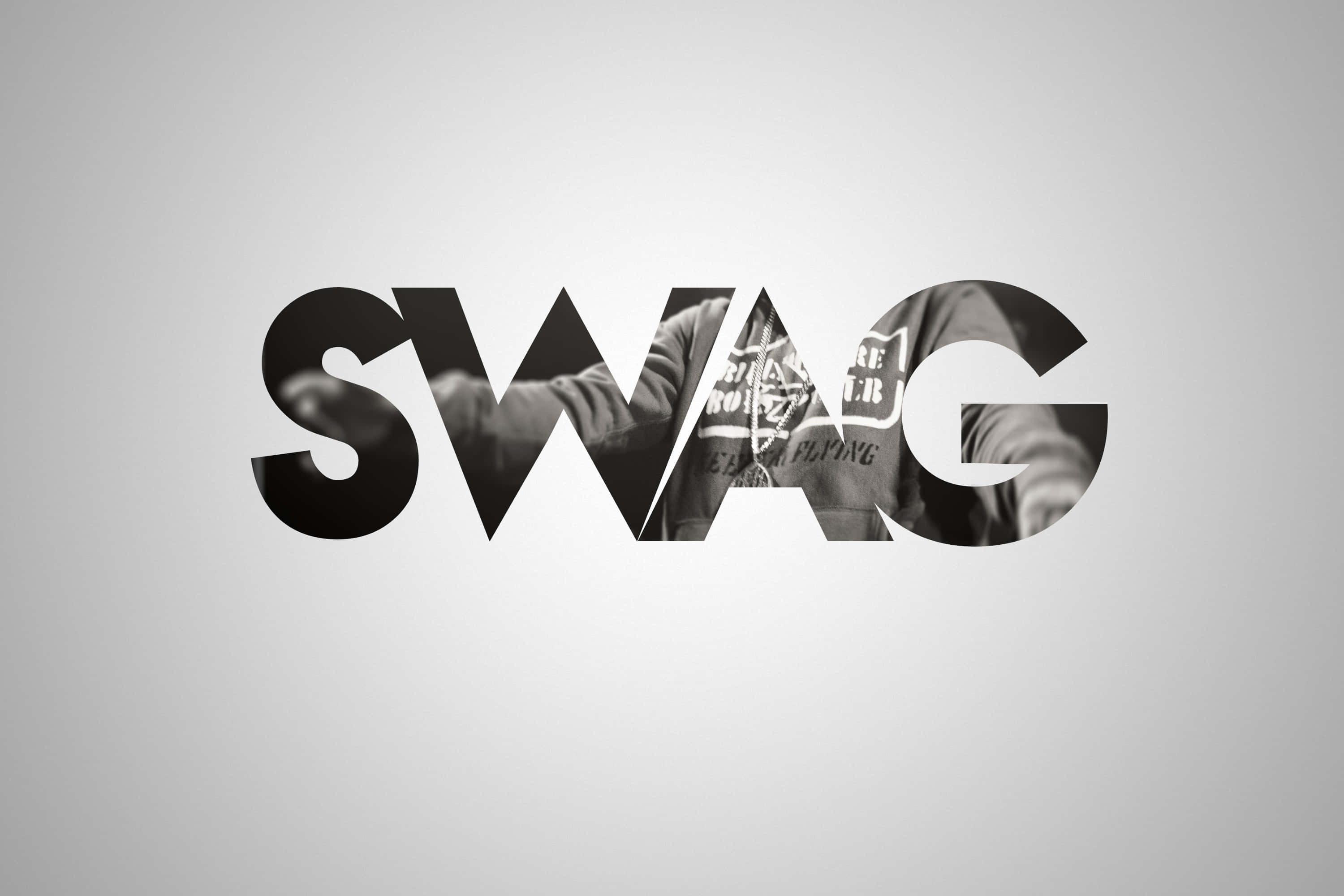 Swag 桌布 壁紙 — 粗體黑色字母拼出SWAG，字母內嵌有人物剪影，背景為漸變灰色。