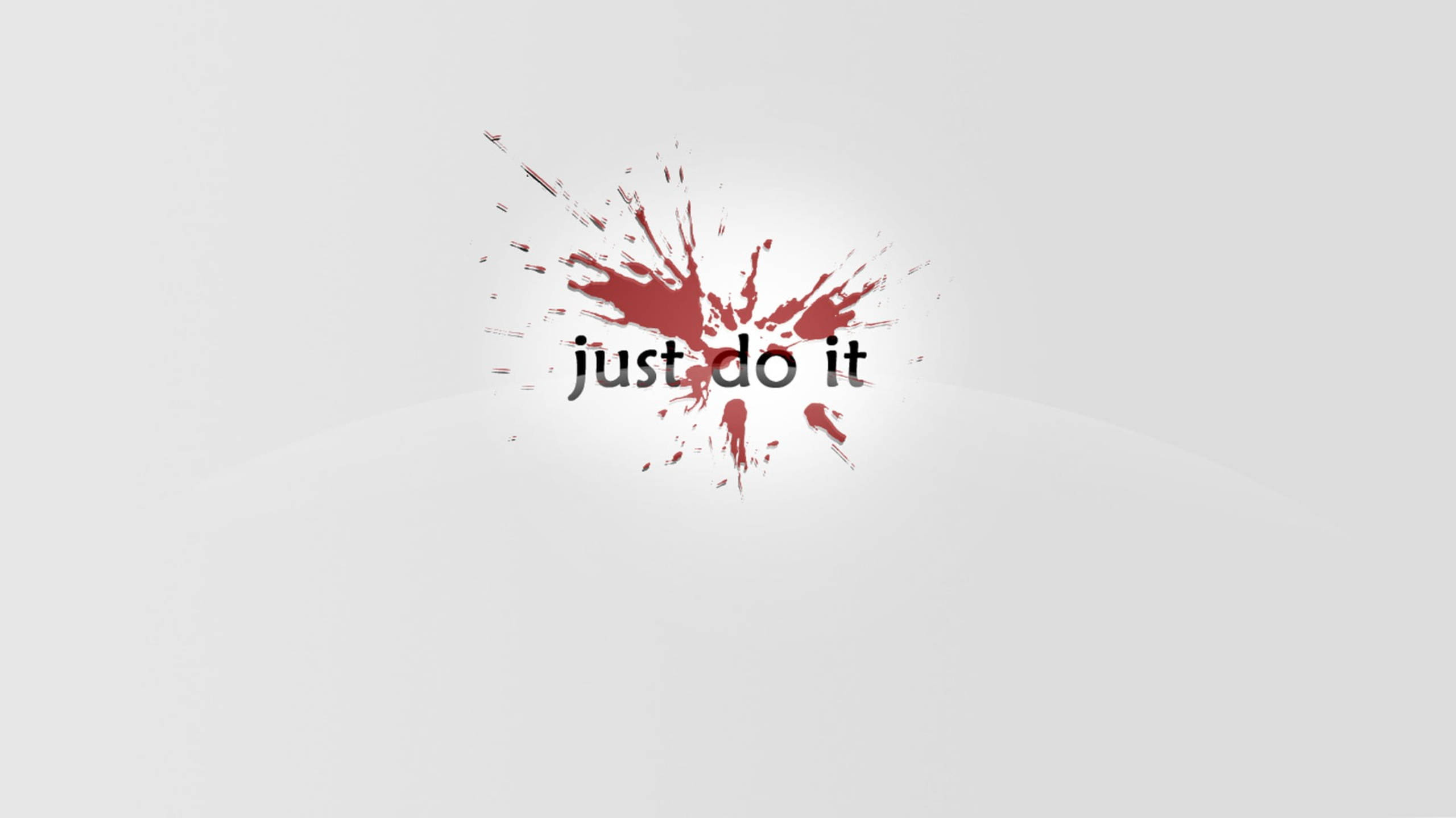 就去做吧 桌布 壁紙 — 粗體黑色文字 just do it 從鮮紅色油漆飛濺中迸發出來，背景是簡約的淺灰色。