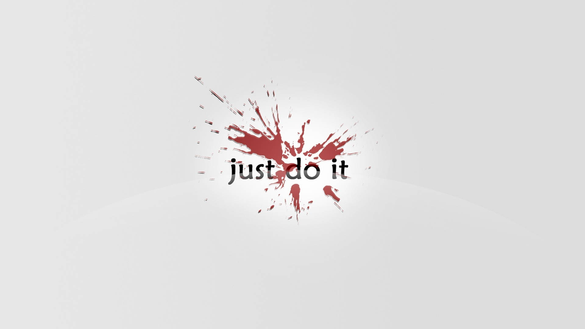Nike iPhone 桌布 壁紙 — 粗體黑色文字 just do it 從動態的紅色油漆飛濺中迸發出來，背景是簡約的淺灰色。