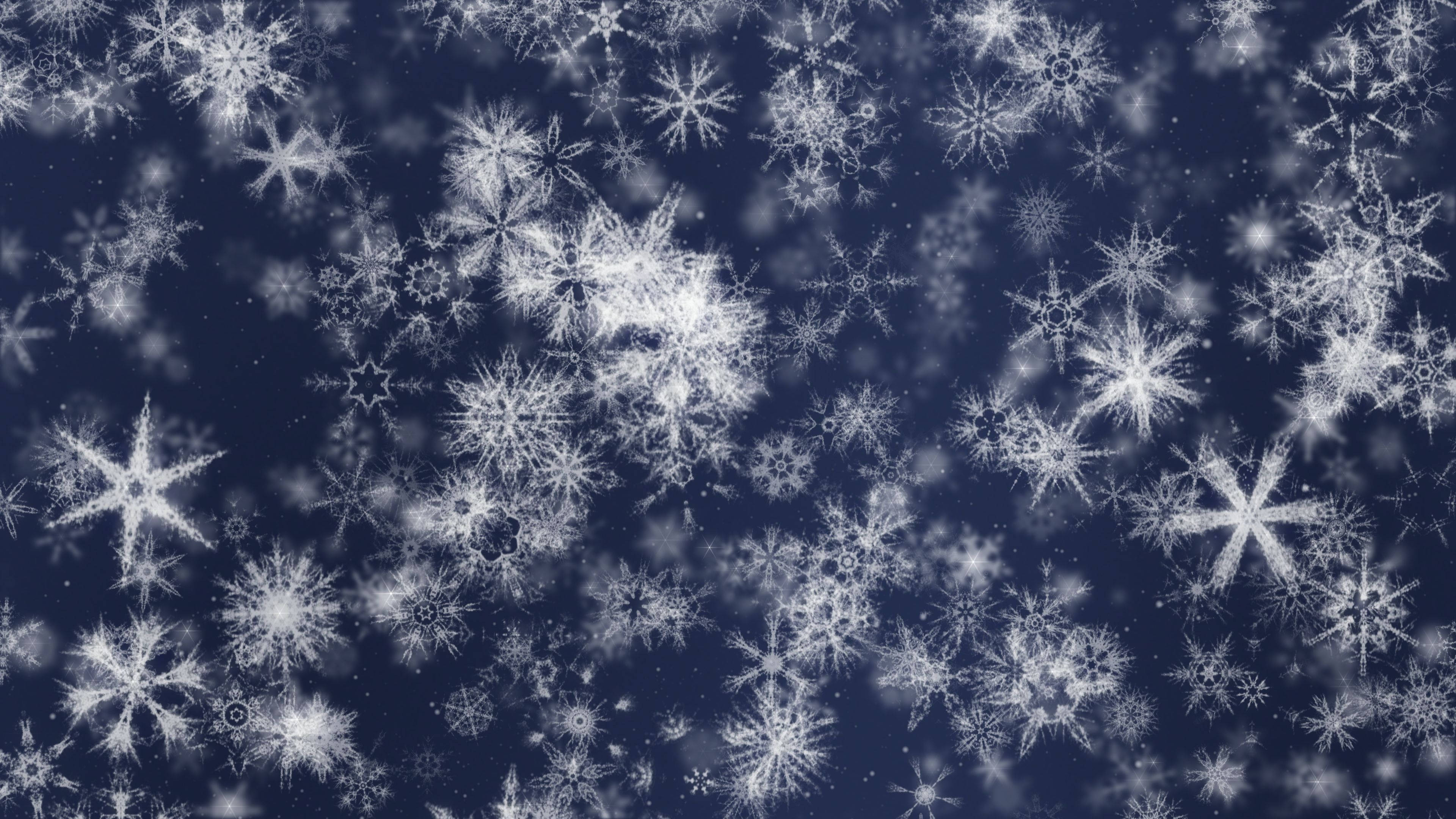 雪景 桌布 壁紙 — 精緻的白色雪花在深海軍藍背景下飄動，營造出柔和夢幻的冬日場景。