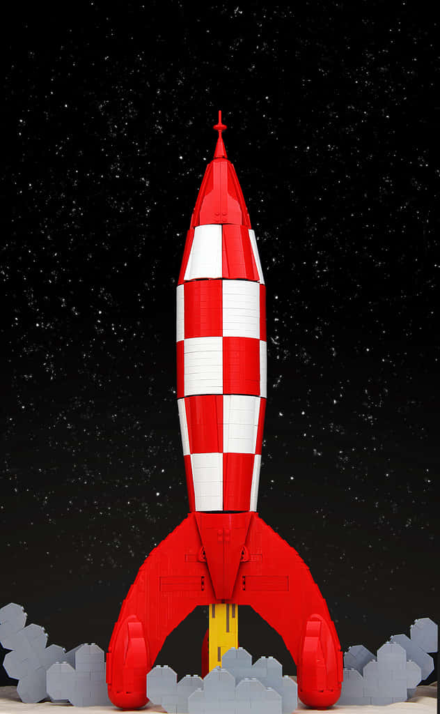 火箭 桌布 壁紙 — 紅白格紋LEGO火箭發射到滿天星斗的夜空，下方有灰色LEGO雲。