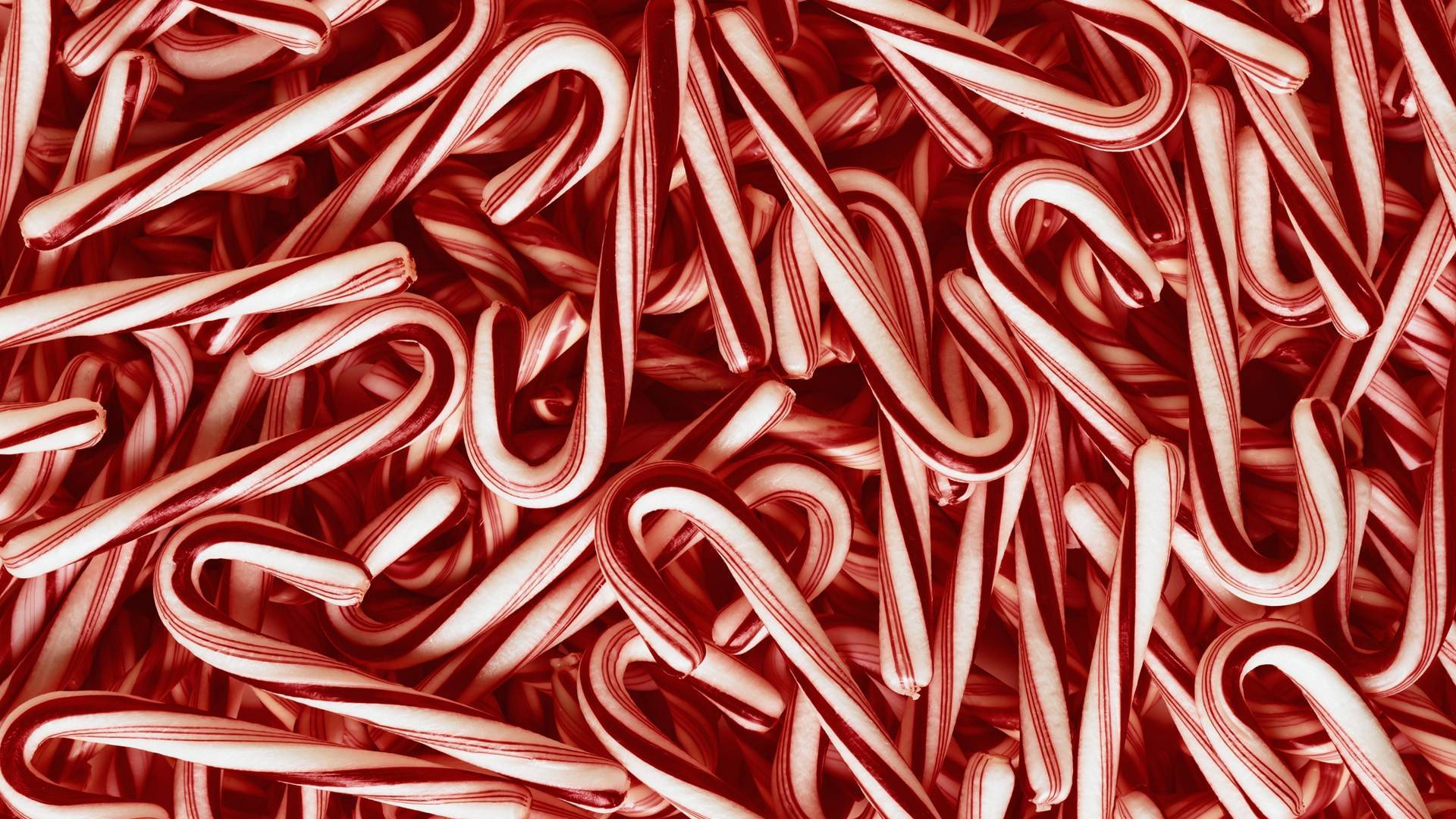 拐杖糖 桌布 壁紙 — 紅白條紋拐杖糖的密集特寫，營造出節日糖質紋理。