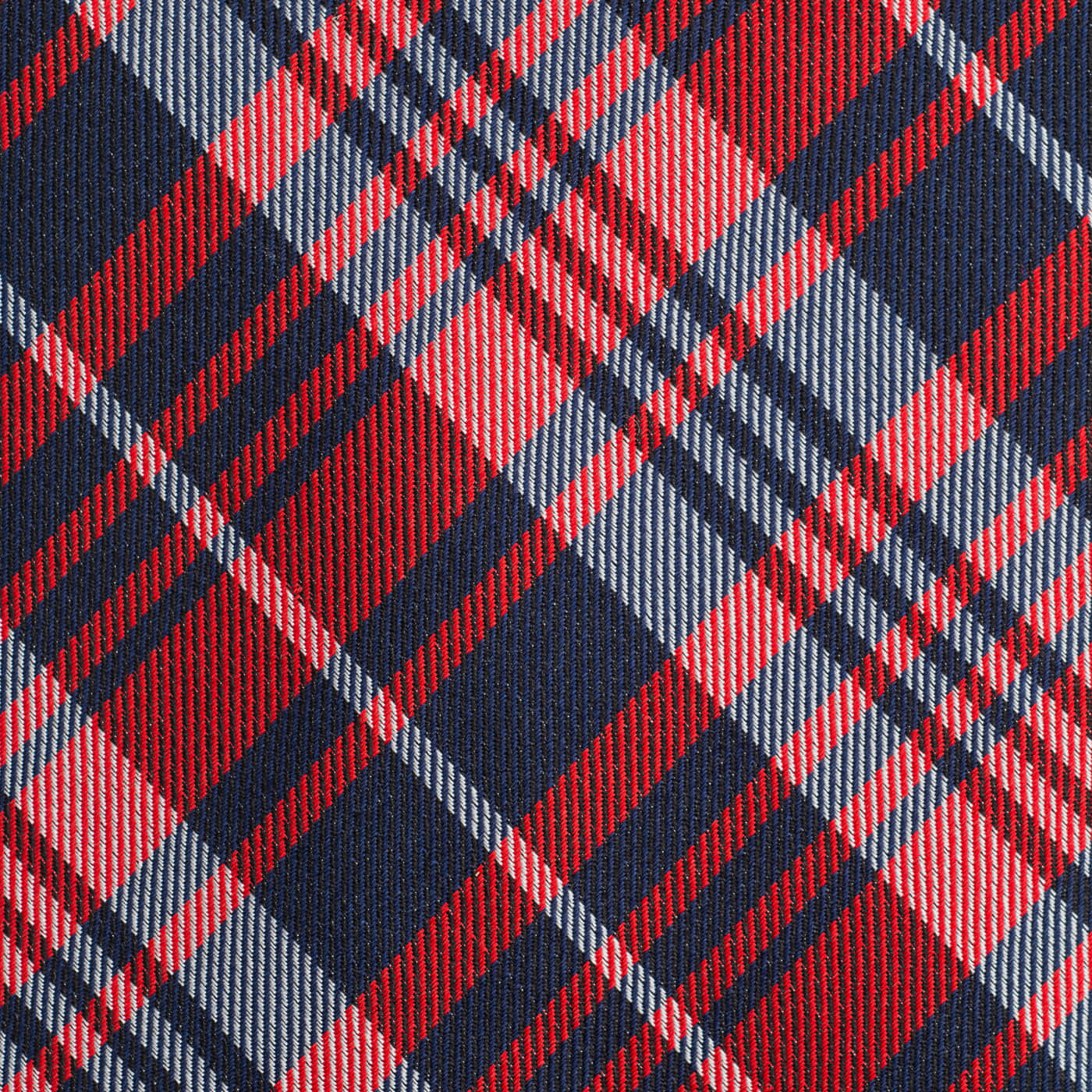 Fabric 桌布 壁紙 — 紅色、海軍藍和淺灰色大膽對角格子圖案的紋理布料特寫。