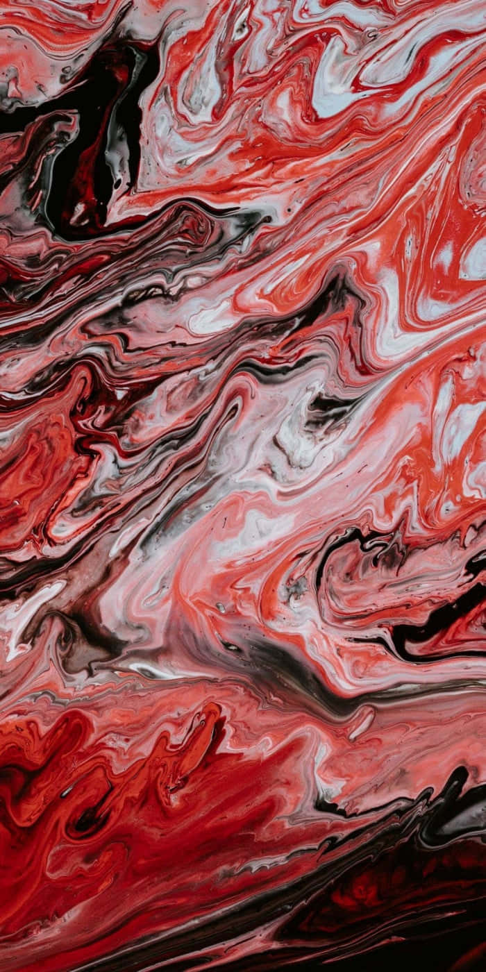 Red Marble 桌布 壁紙 — 紅色、白色和黑色液體顏料形成的鮮豔漩渦抽象圖案，創造出動態的有機形態。