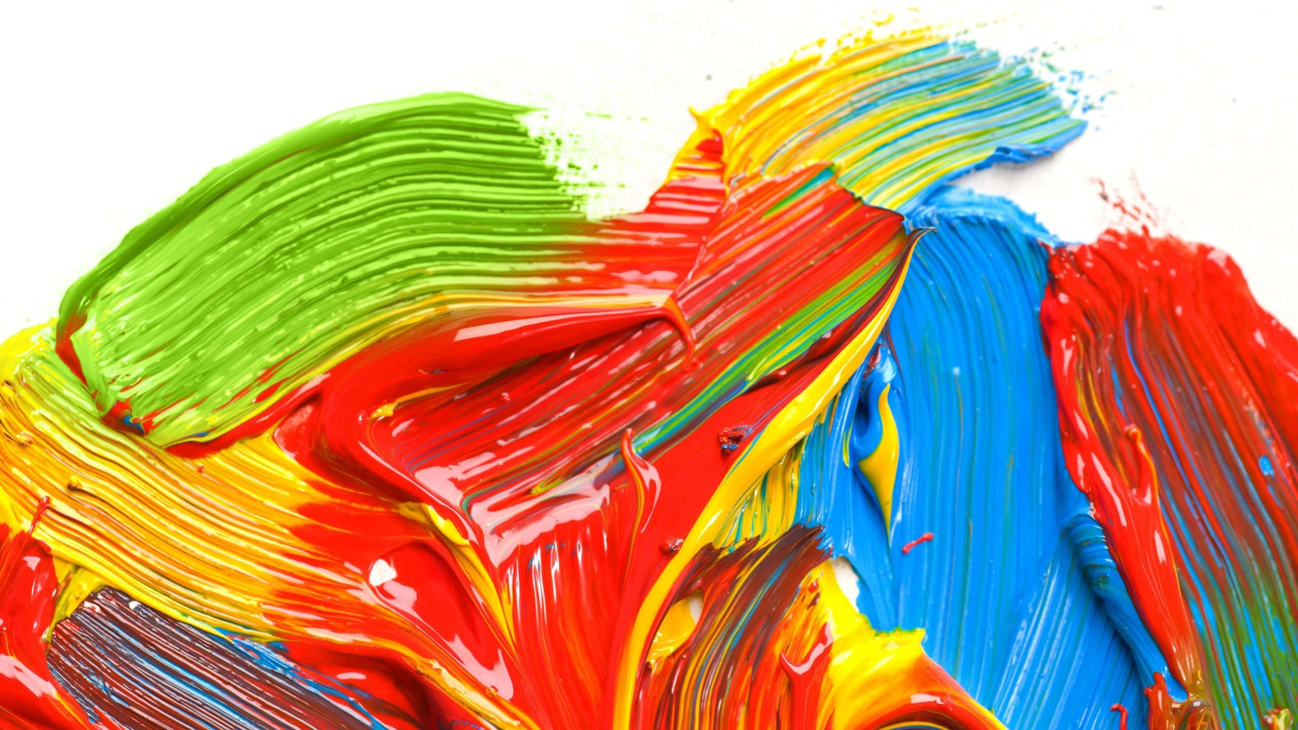 paint 桌布 壁紙 — 紅色、黃色、綠色和藍色的鮮豔厚塗筆觸在白色表面上動態融合。
