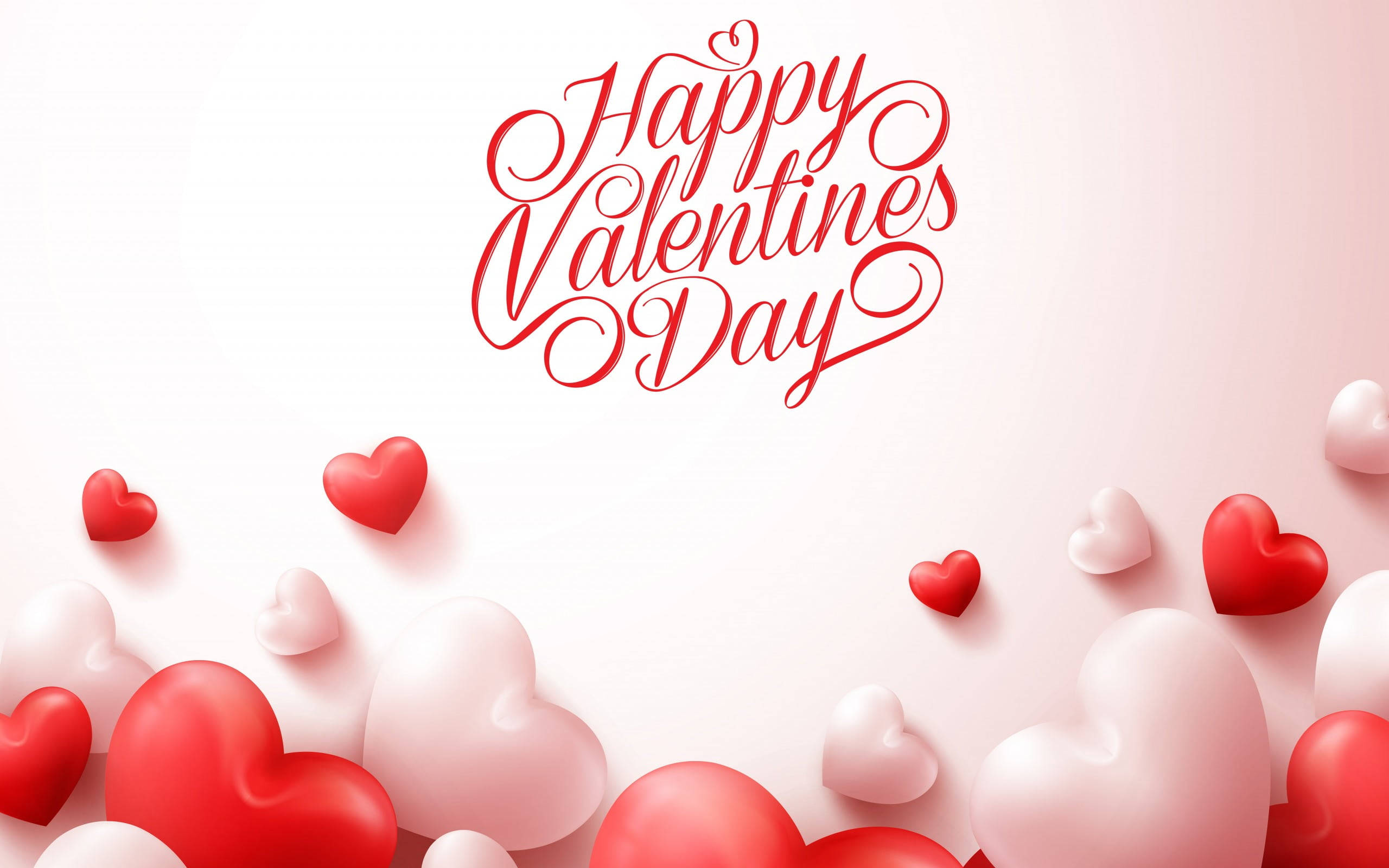 愛心 桌布 壁紙 — 紅色和白色的心形在優雅的手寫文字「Happy Valentine's Day」周圍飄浮，背景是柔和的粉紅色漸變。