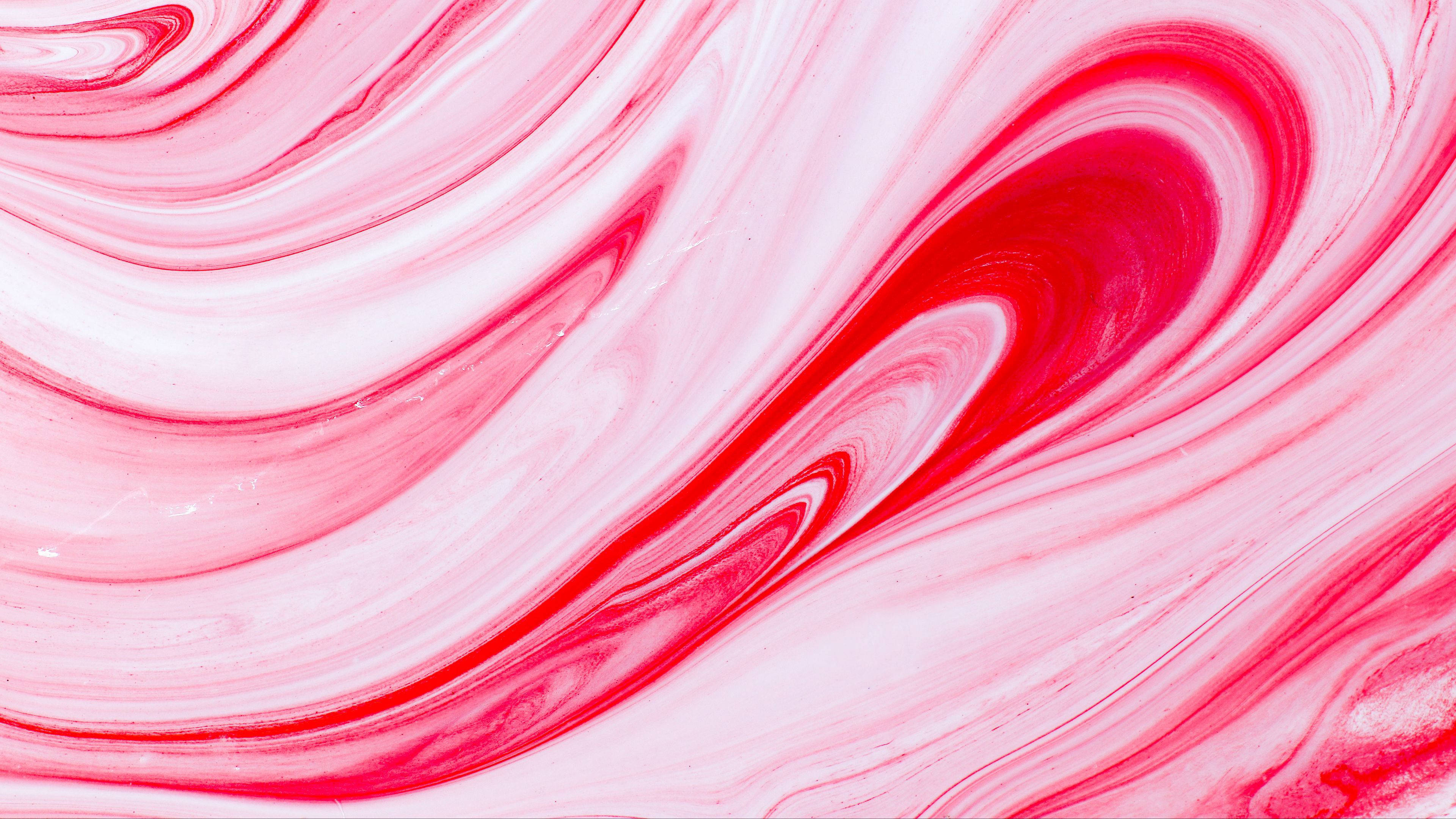 Pink And White 桌布 壁紙 — 紅色和白色顏料的鮮豔漩渦圖案創造出具有流暢動感的動態抽象構圖。