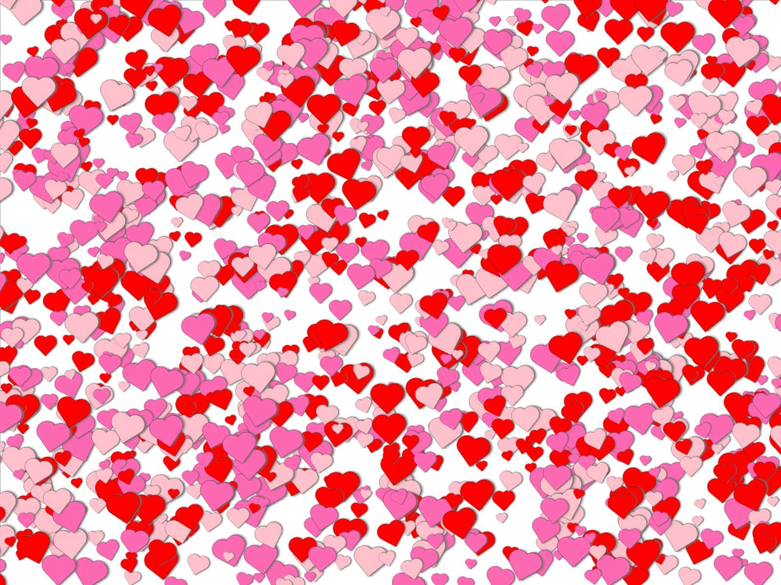 Heart Pattern 桌布 壁紙 — 紅色和粉紅色的心形在潔白背景上形成充滿活力的瀑布效果，呈現節日五彩紙屑的圖案。