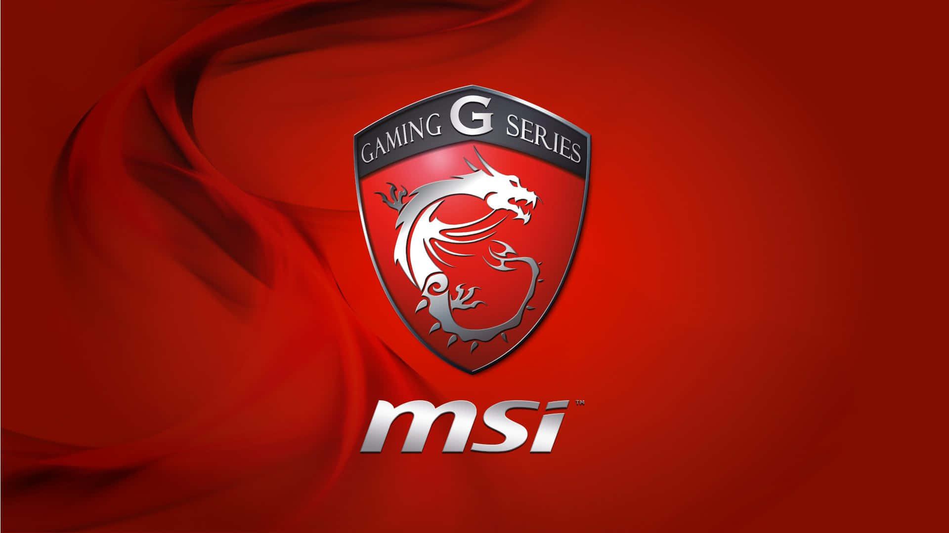 微星 桌布 壁紙 — 紅色布料背景上的銀色龍紋章，帶有MSI Gaming G Series標誌。