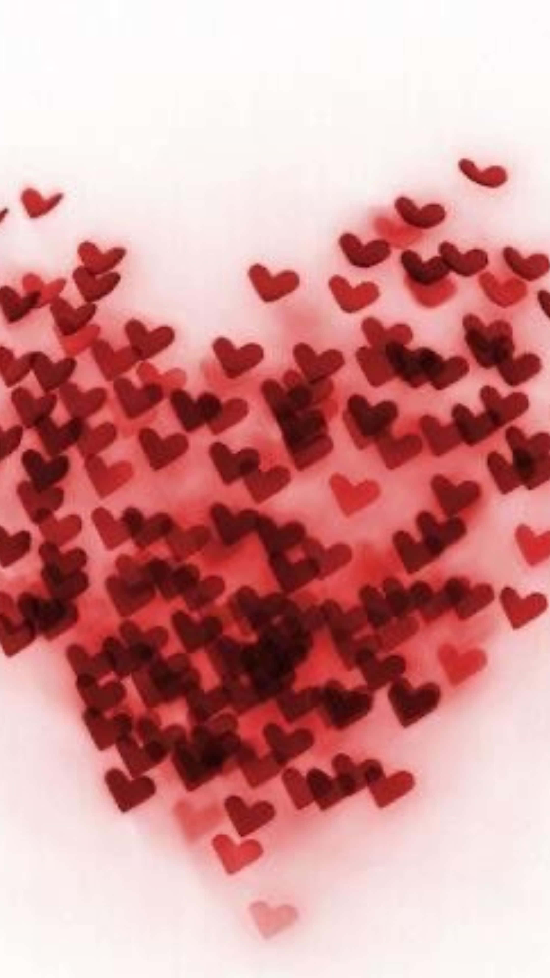 Red Hearts 桌布 壁紙 — 紅色心形的柔和漸變在淡粉色背景上形成一個大的心形。
