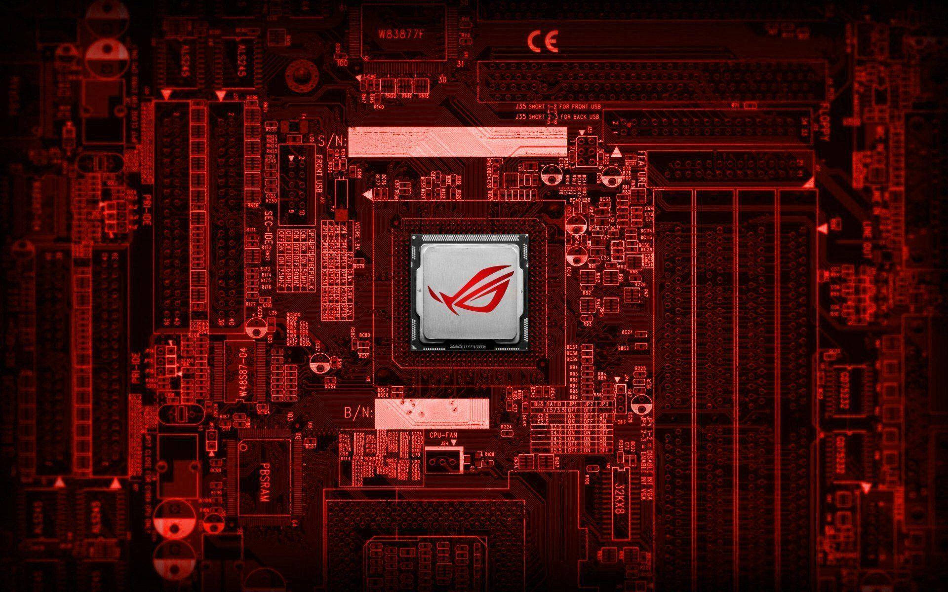 Motherboard 桌布 壁紙 — 紅色燈光下的ASUS ROG主機板特寫，中央CPU帶有ROG標誌在戲劇性燈光下發光。