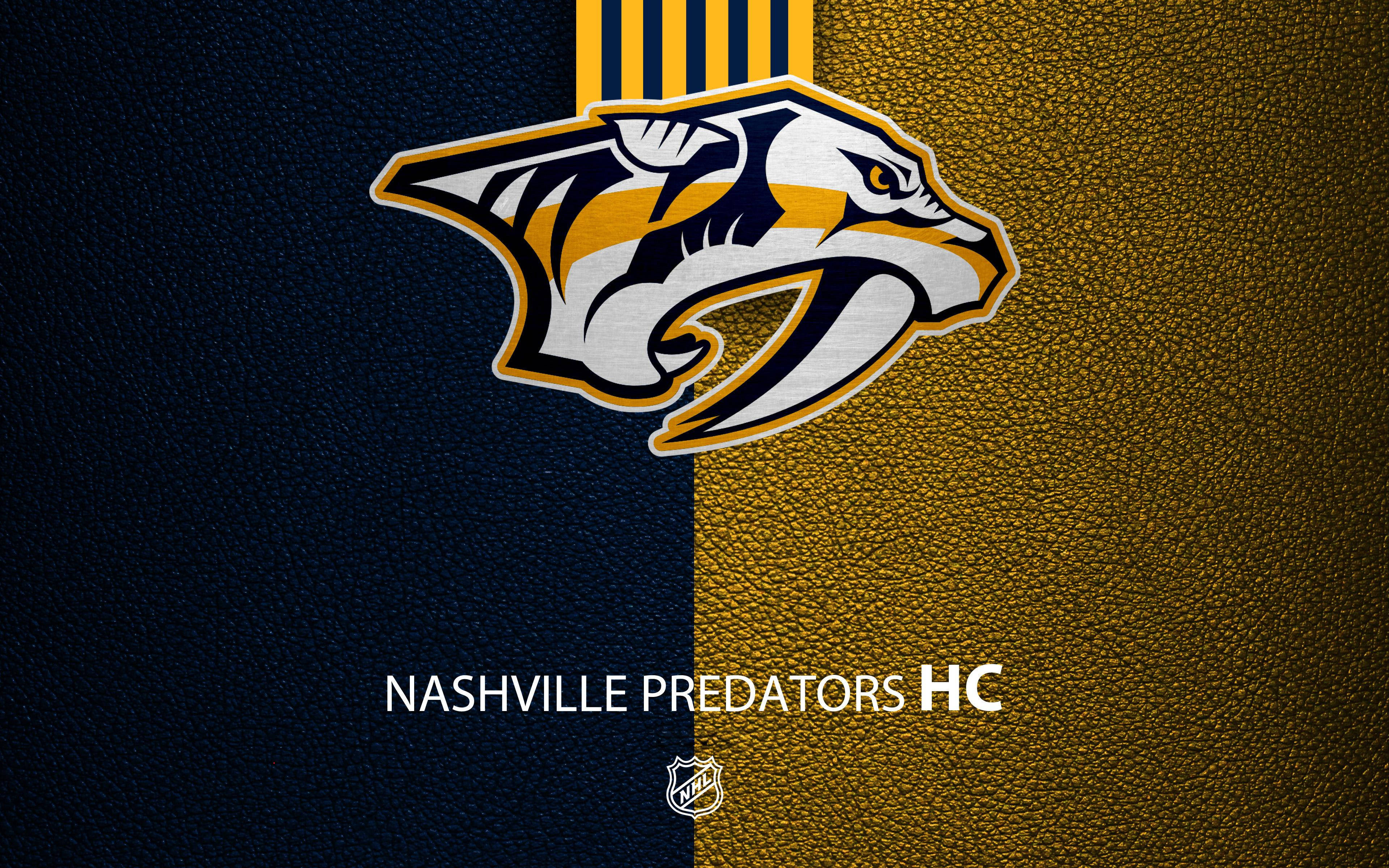 Predators 桌布 壁紙 — 納什維爾掠奪者隊標誌，位於有紋理的深藍色和金色背景上，下方有球隊名稱和NHL徽章。
