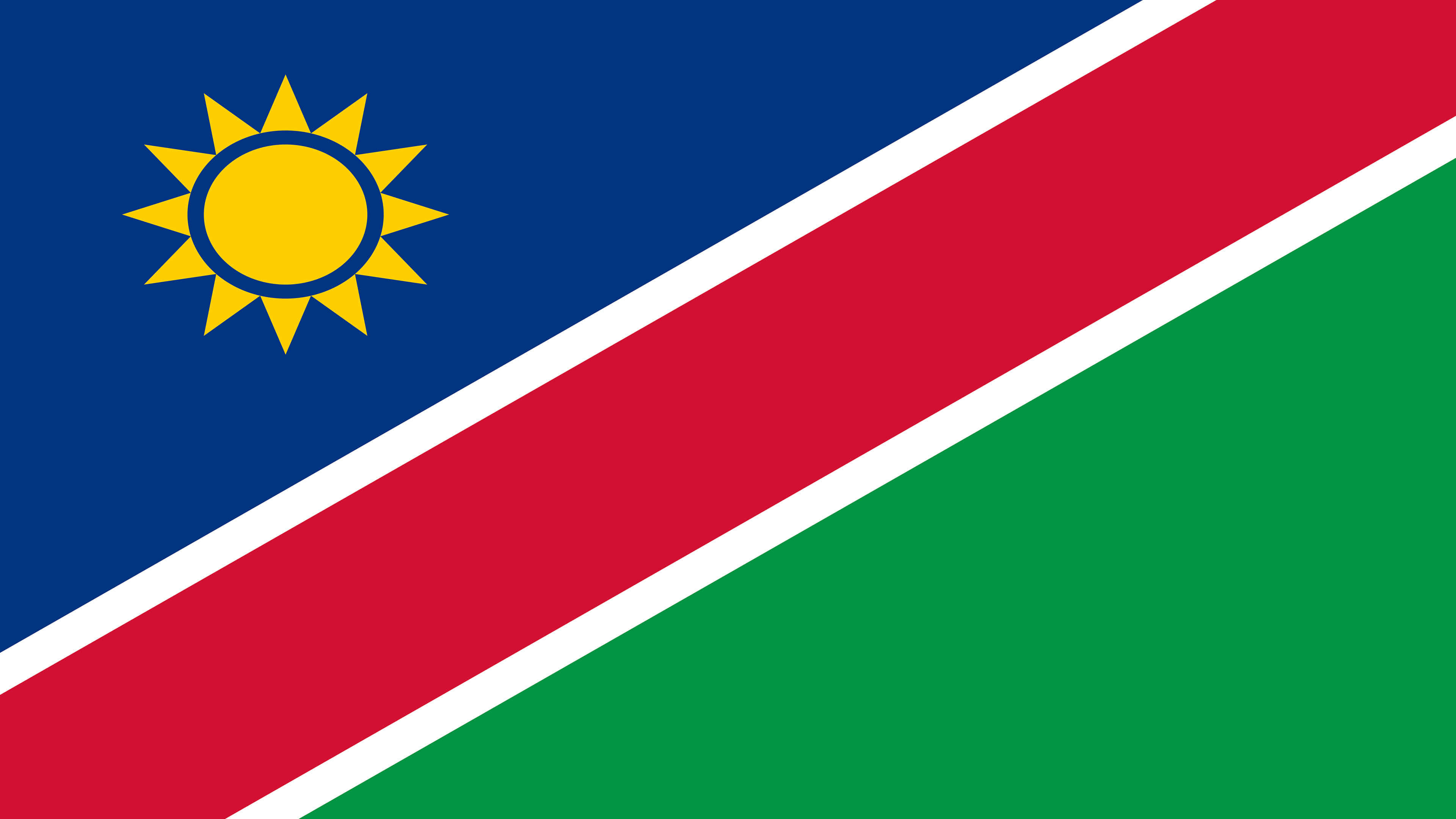 Namibia 桌布 壁紙 — 納米比亞國旗的特色是一條大膽的紅色對角線條，邊緣為白色，將藍色和綠色區域分開，左上角有一顆金色的太陽。