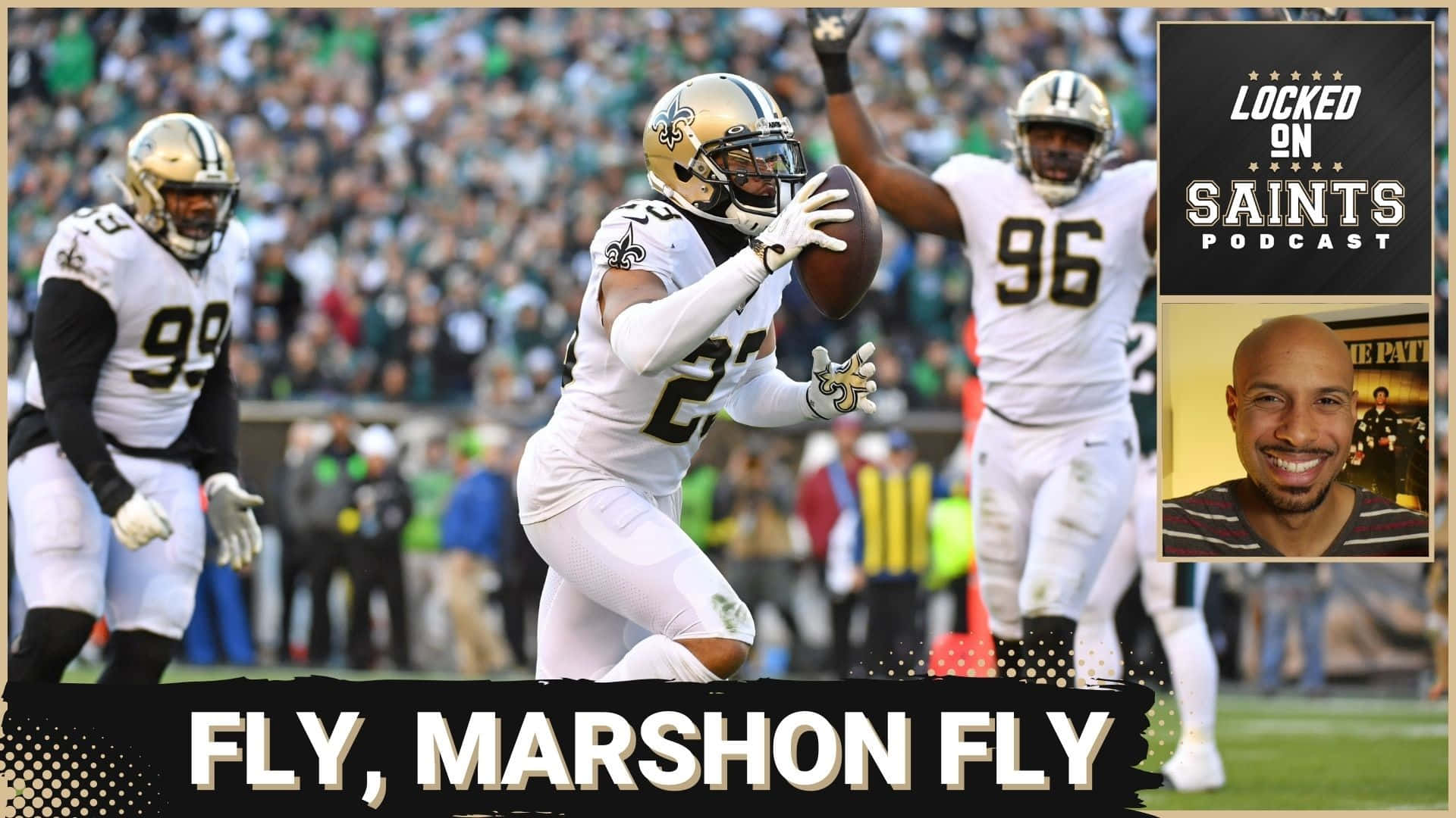 New Orleans Saints 桌布 壁紙 — 紐奧良聖徒隊球員馬尚·拉蒂摩爾在比賽中跳起接球，背景有隊友和觀眾。