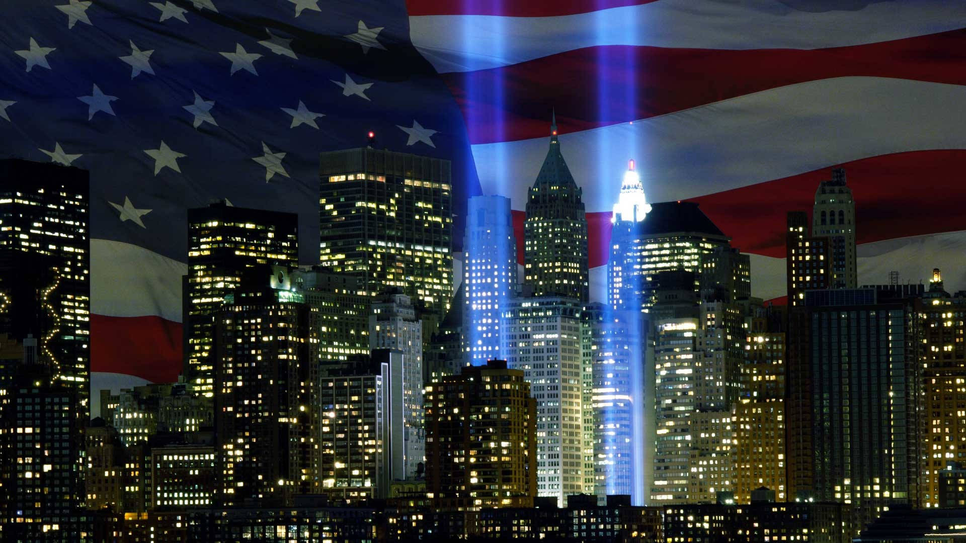 911 Memorial 桌布 壁紙 — 紐約夜景，摩天大樓燈火通明，Tribute in Light 光束穿過美國國旗疊加層。
