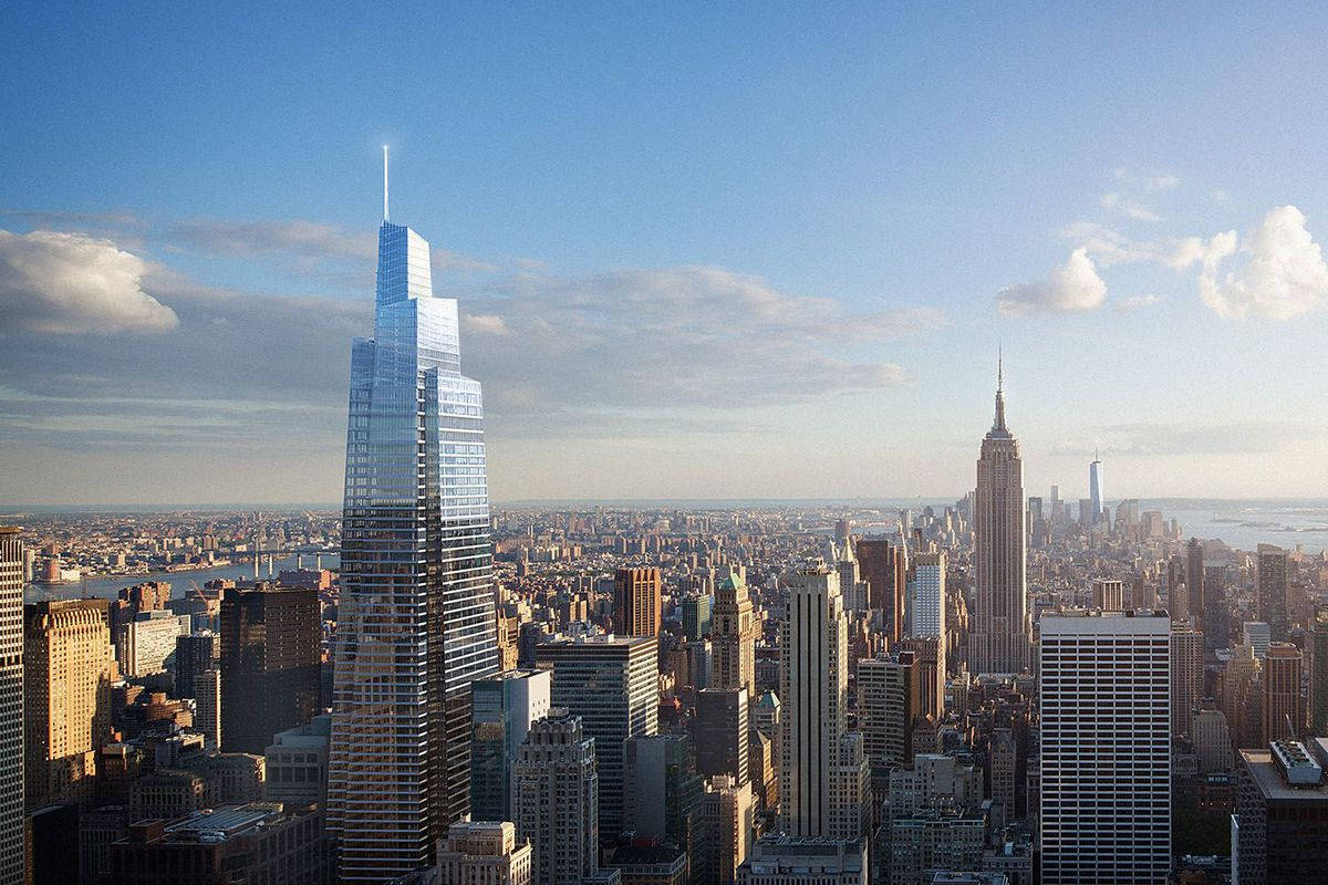 Skyscraper 桌布 壁紙 — 紐約市天際線在日出時的全景視圖，玻璃摩天大樓在藍天白雲下反射金色光芒。