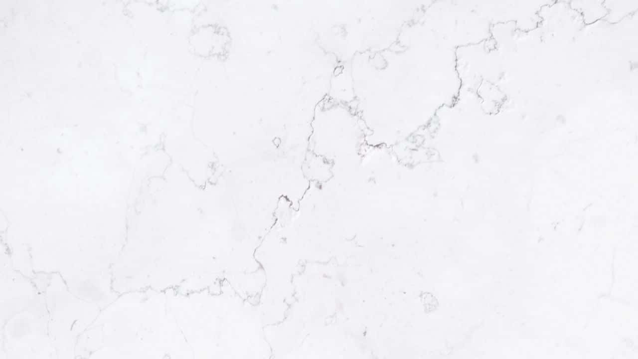 Granite 桌布 壁紙 — 純白大理石的近距離特寫，帶有精緻的灰色紋理，形成優雅的自然圖案。