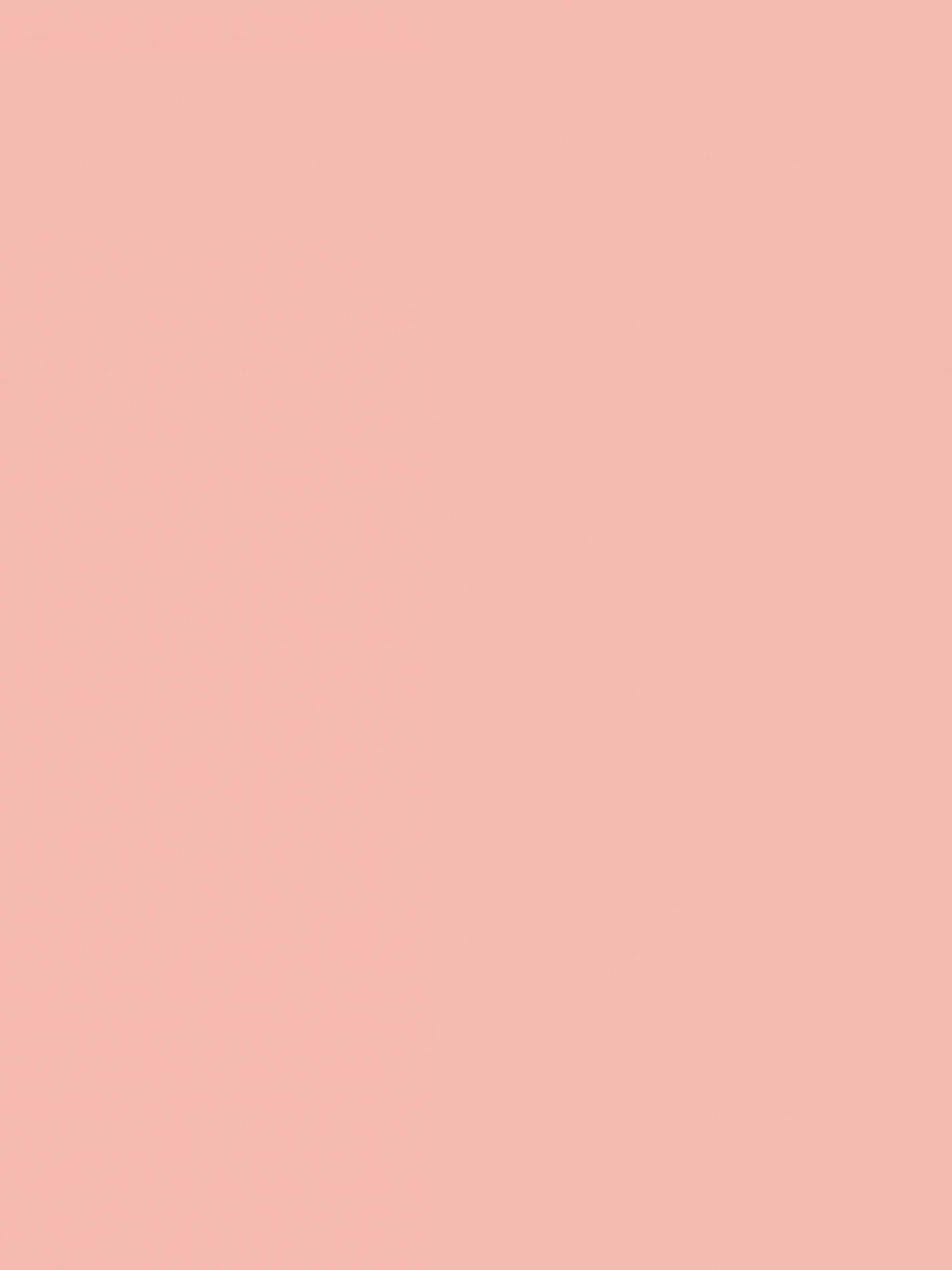 Pink Solid 桌布 壁紙 — 純色柔和蜜桃色背景，沒有可見的物體或圖案。