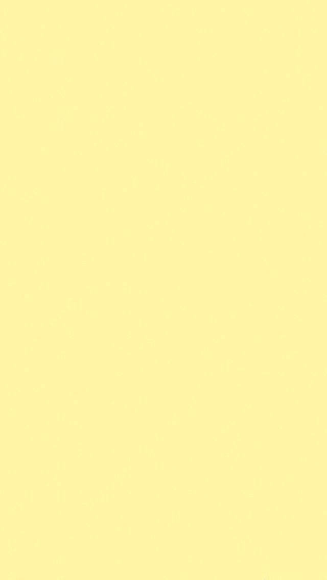 Pastel Yellow 桌布 壁紙 — 純色淡黃色背景，帶有細微紋理和均勻照明。