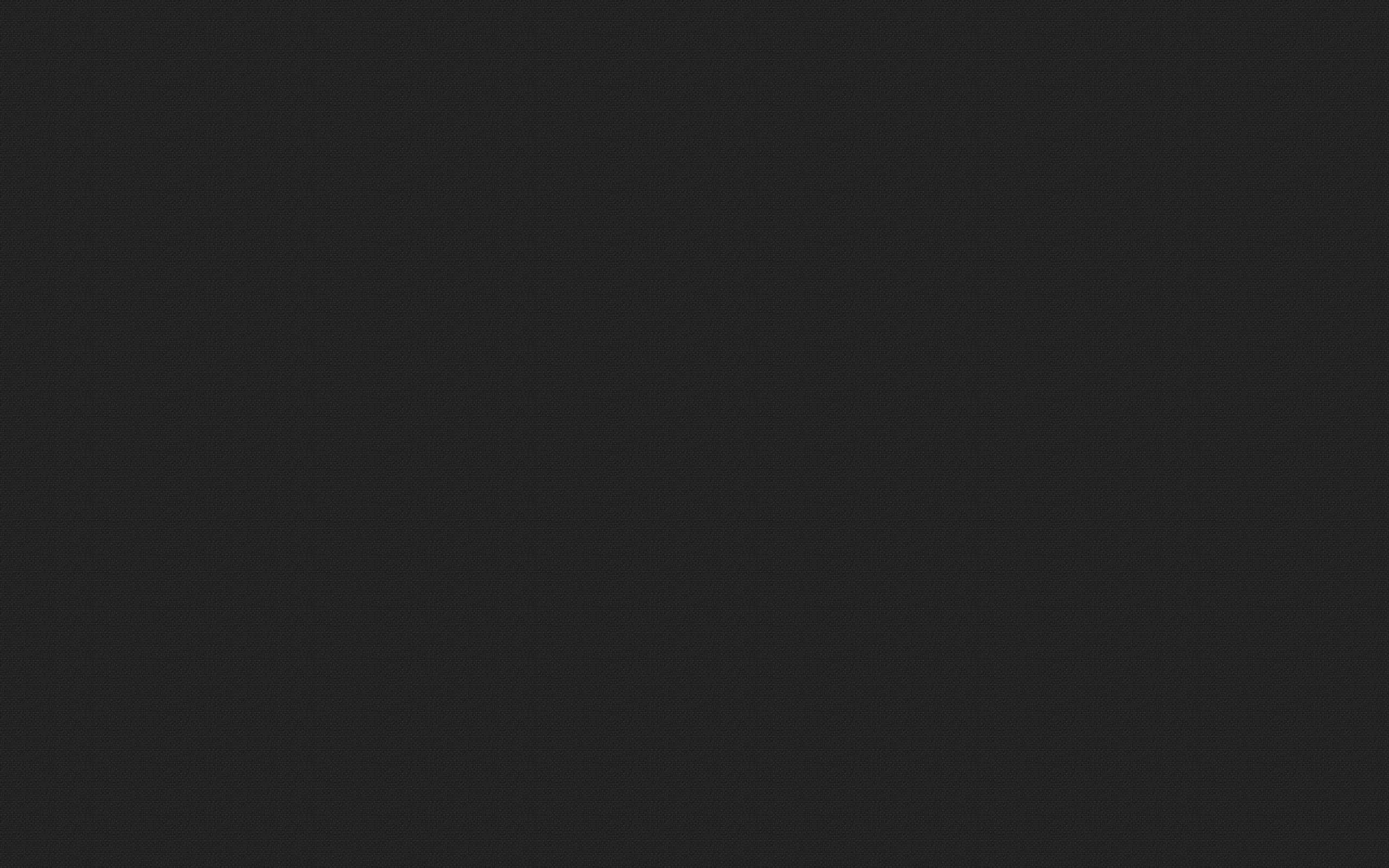 Dark Grey 桌布 壁紙 — 純色深灰色紋理背景，帶有細微顆粒和均勻色調。