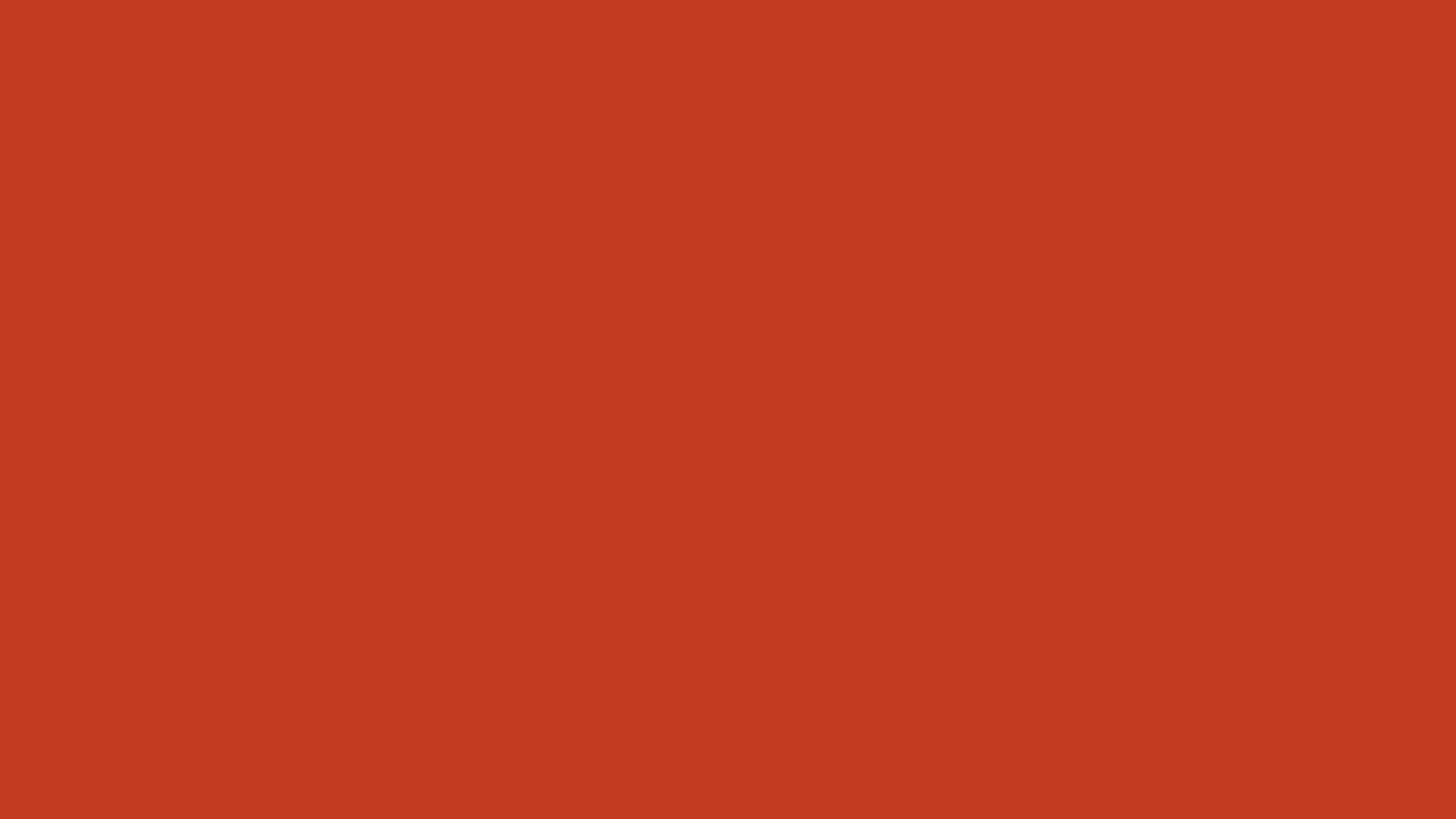 Pastel Red 桌布 壁紙 — 純色陶土紅背景，無可見物體或細節。