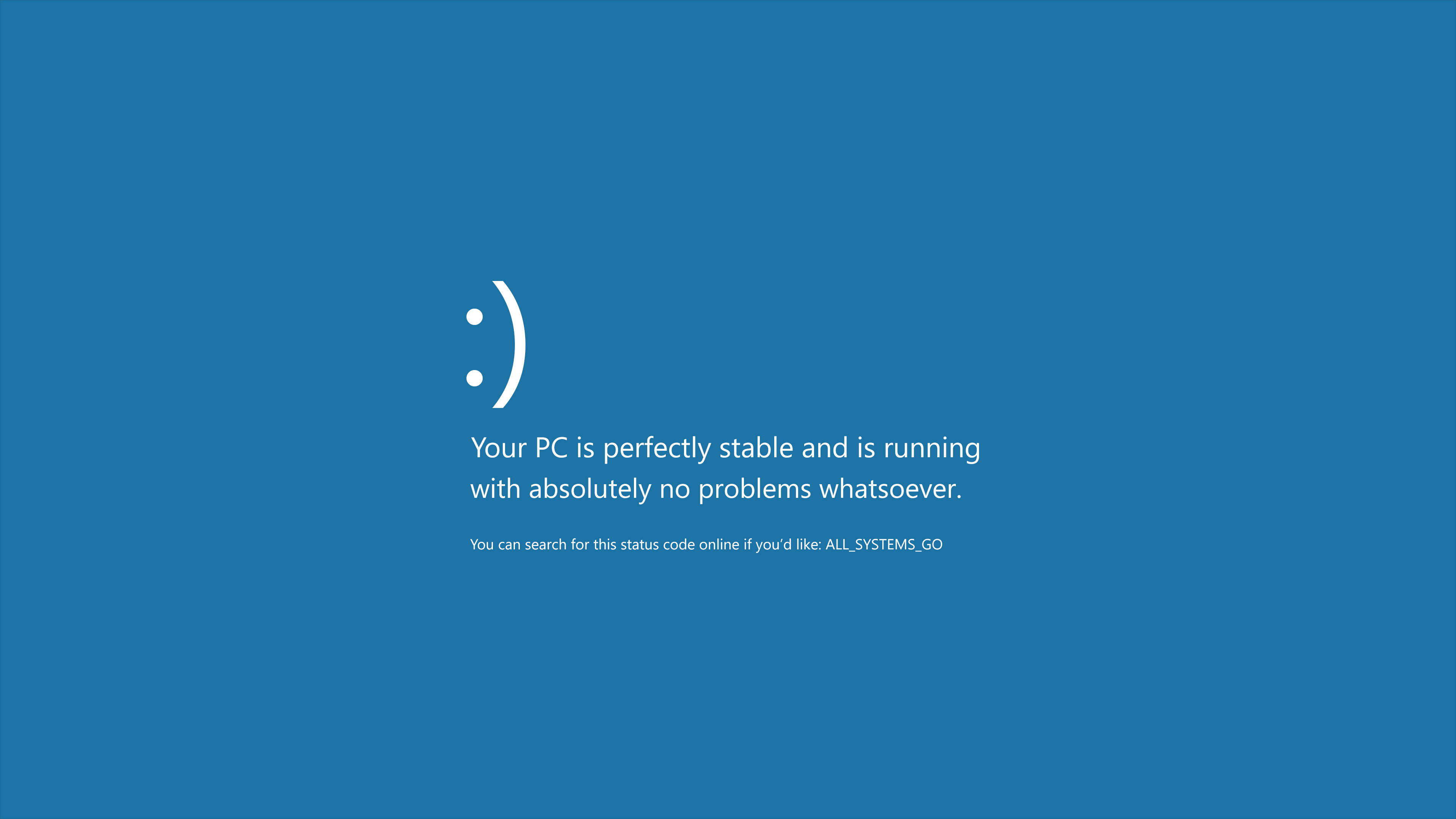 Windows 桌布 壁紙 — 純藍色螢幕顯示笑臉和文字，聲明PC完全穩定，沒有問題。