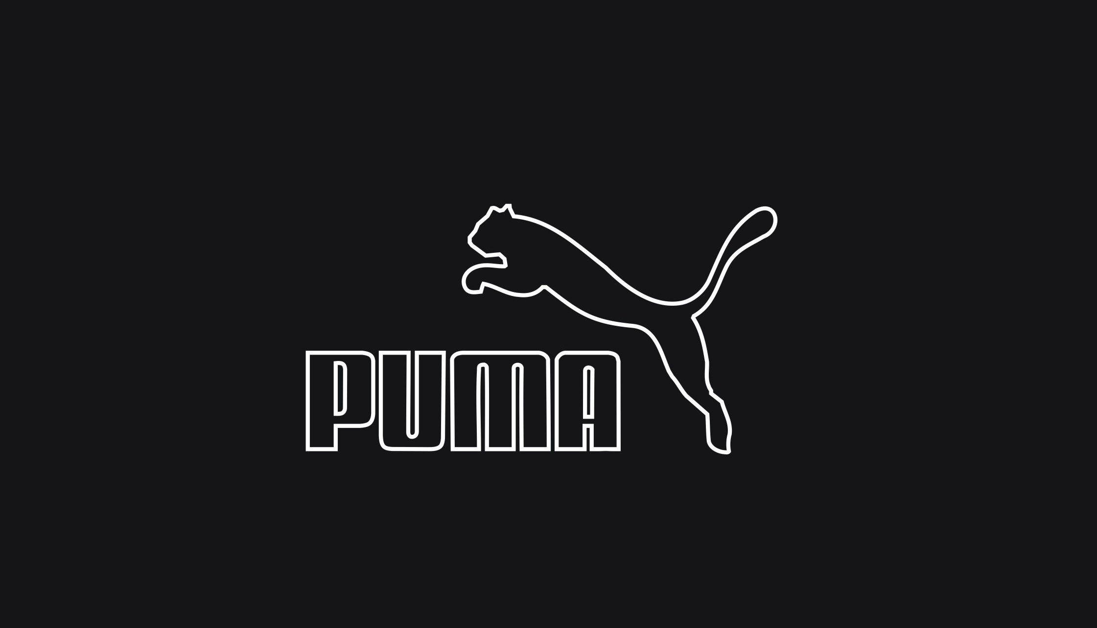 Puma 桌布 壁紙 — 純黑色背景上，簡約白色Puma標誌，帶有跳躍貓剪影和粗體文字。