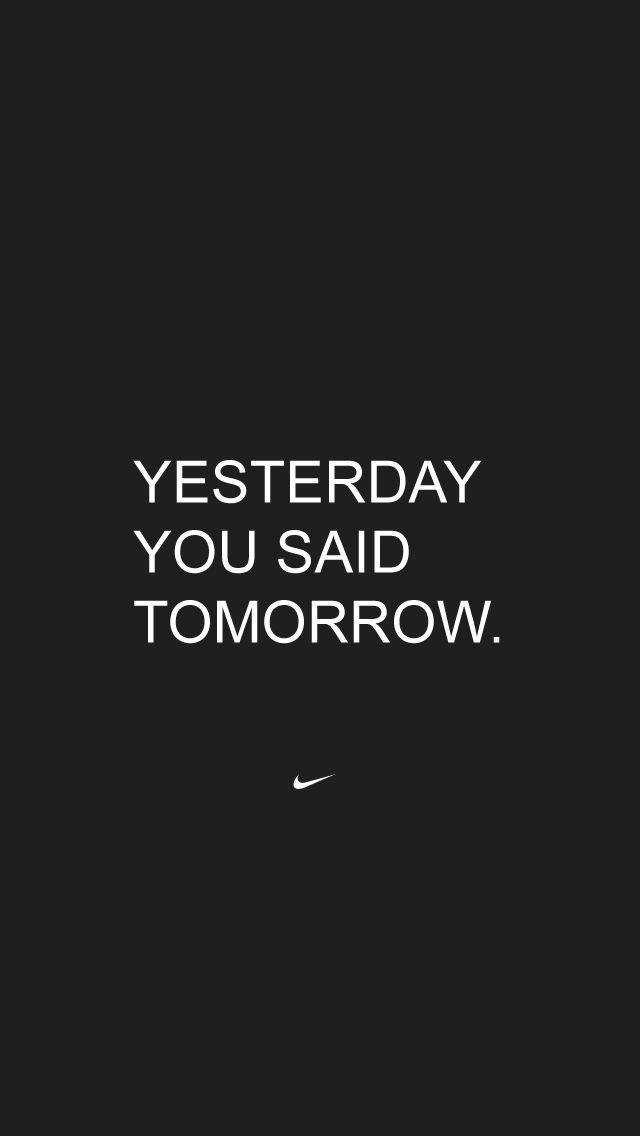Fitness Motivation iPhone 桌布 壁紙 — 純黑色背景上，粗體白色文字寫著「YESTERDAY YOU SAID TOMORROW」，下方有一個細小的Nike勾勾。