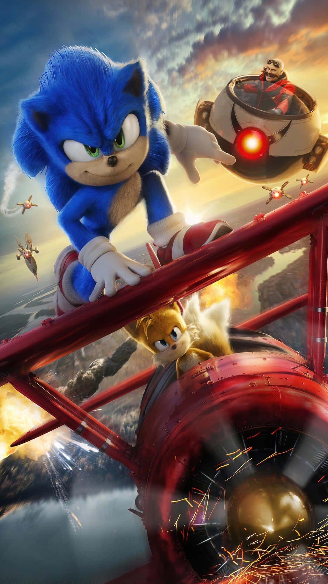 Sonic And Tails 桌布 壁紙 — 索尼克在紅色雙翼飛機上穿越火熱的天空，塔爾斯駕駛，蛋頭博士用他的飛行機器追趕。