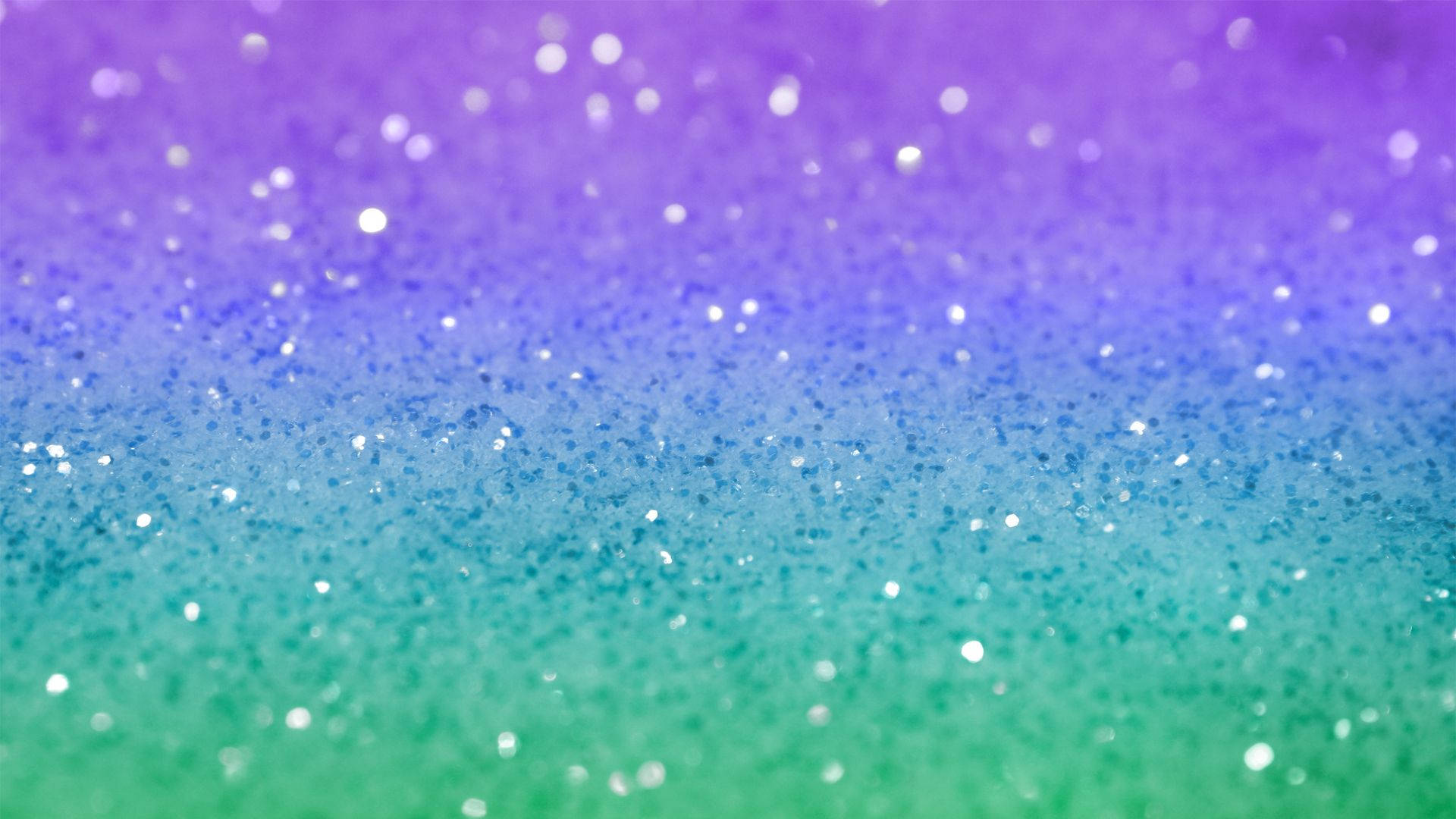 Sparkle 桌布 壁紙 — 紫色、藍色和綠色閃粉的鮮豔漸變，帶有散景高光。