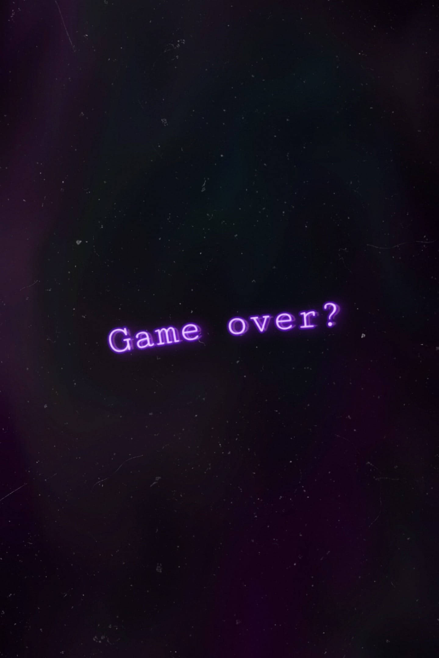 Black And Purple Phone 桌布 壁紙 — 紫色發光的文字顯示「game over?」漂浮在黑暗的宇宙虛空中，帶有星狀斑點和微妙的星雲漩渦。
