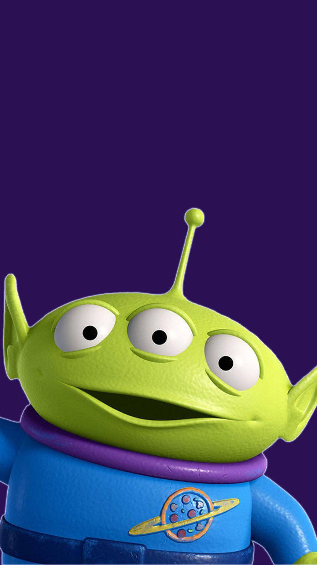 Toy Story Alien 桌布 壁紙 — 紫色背景上，綠色三眼外星人玩具的特寫，戴著紫色領子和藍色太空服。