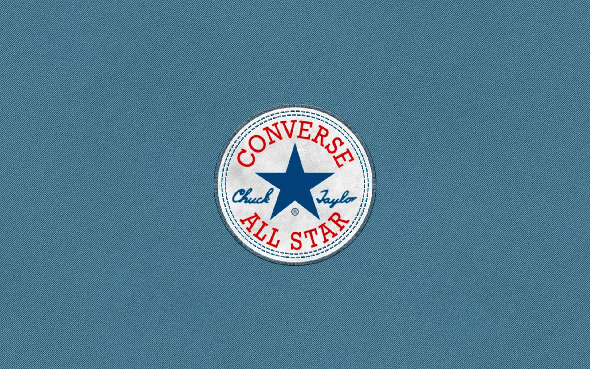 Converse Chuck Taylor All Star 標誌在藍色布料背景上 — Valorant Logo 壁紙