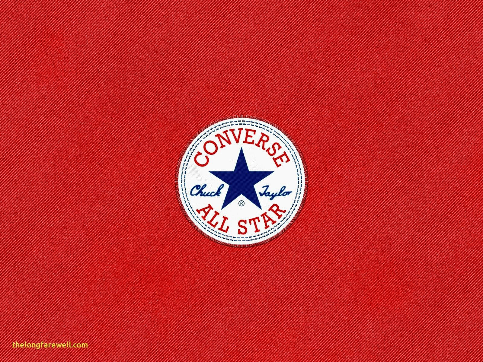 紅色美學動圖 桌布 壁紙 — 經典 Converse Chuck Taylor All Star 標誌居中於有紋理的紅色布料背景上。