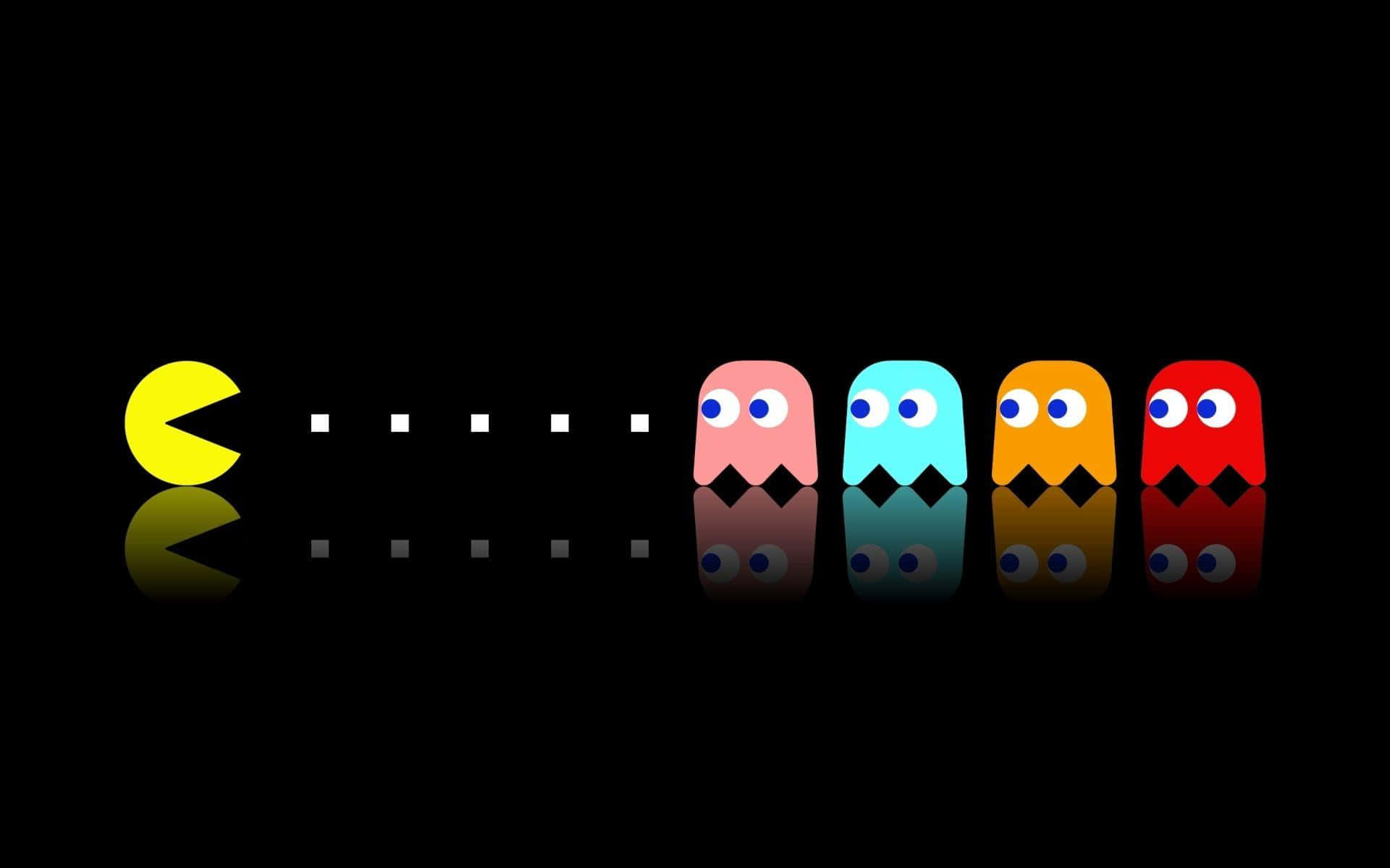 Pacman 桌布 壁紙 — 經典 Pacman 與四個彩色鬼魂在黑色背景上排成一列，帶有倒影。