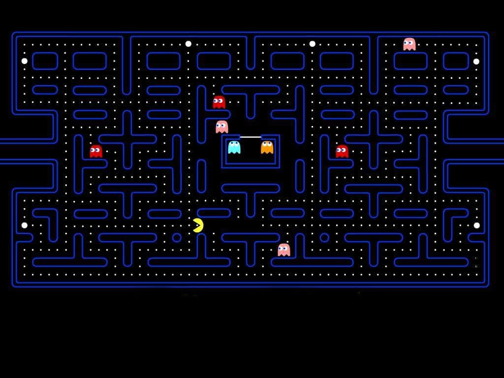 Pacman 桌布 壁紙 — 經典 Pacman 遊戲場景，黃色 Pacman 在黑色背景的藍色迷宮中追逐鬼魂。