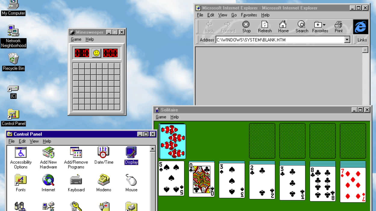 Windows 95 動態圖 桌布 壁紙 — 經典 Windows 98 桌面，開啟了踩地雷、接龍和 Internet Explorer，背景為藍天桌布。