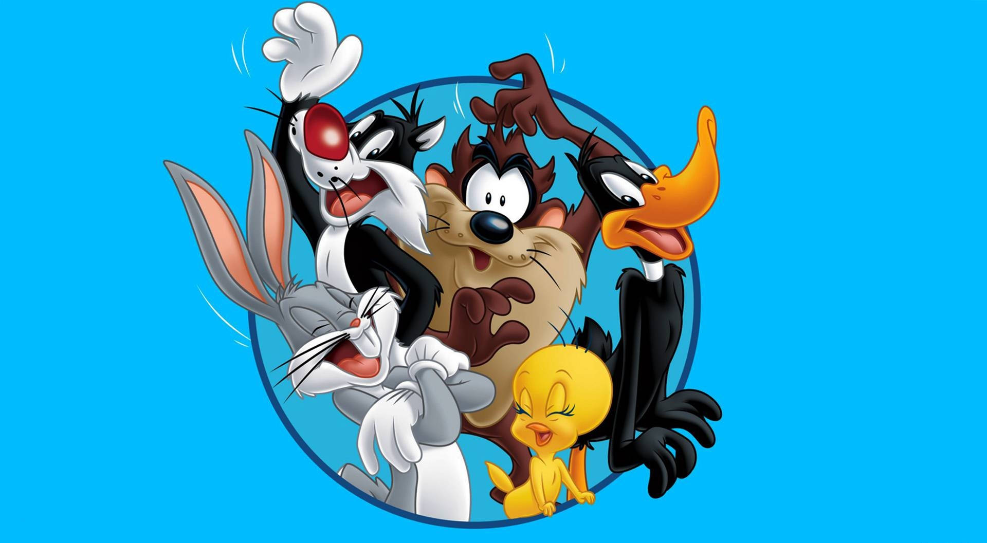 Sylvester 桌布 壁紙 — 經典Looney Tunes角色如賓尼兔和達菲鴨在圓形框架內對著明亮藍色背景愉快地擺姿勢。