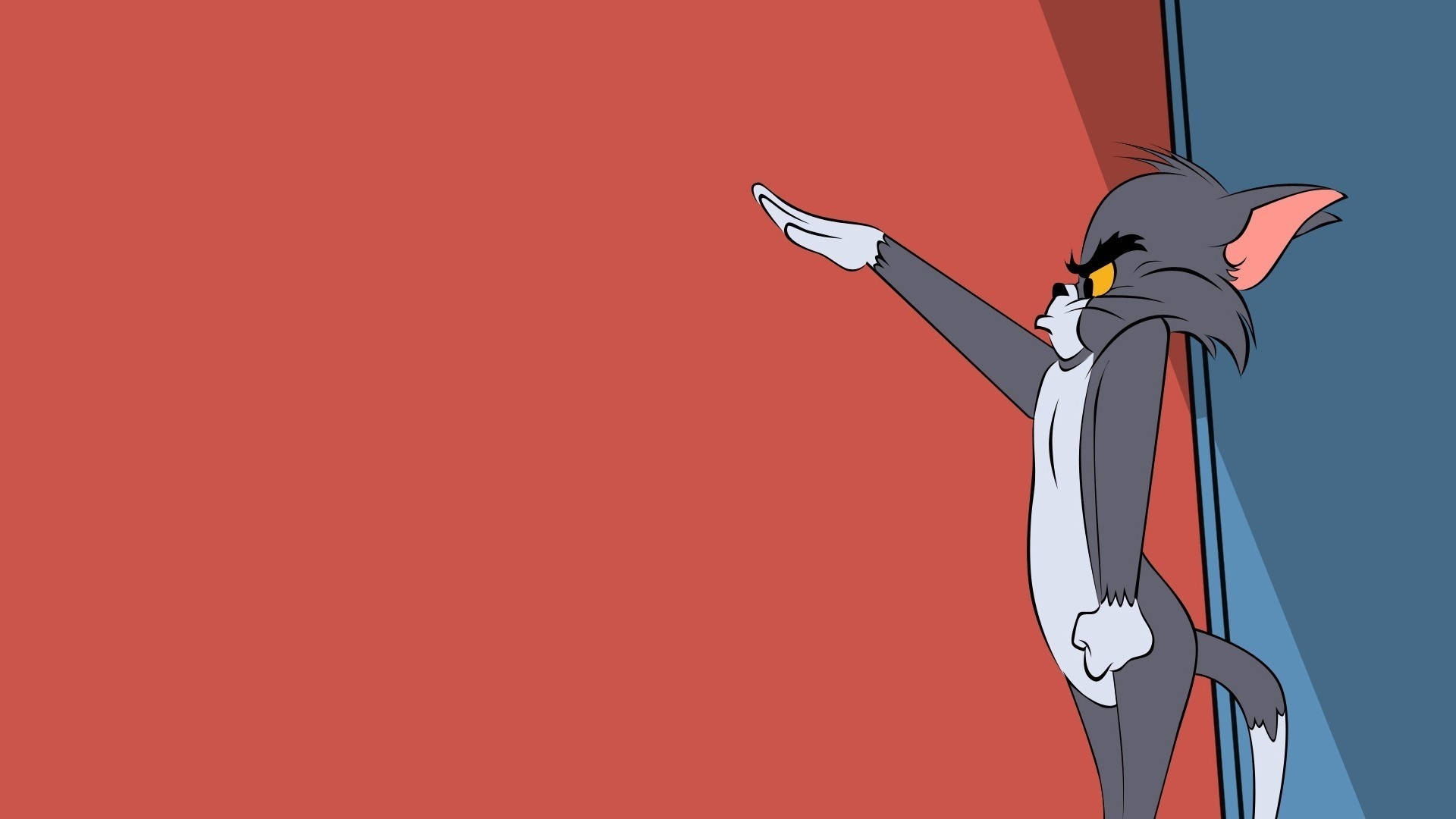 tom and jerry iPhone 桌布 壁紙 — 經典卡通中的貓湯姆在鮮明的紅色和藍色背景下擺出自信的姿勢。