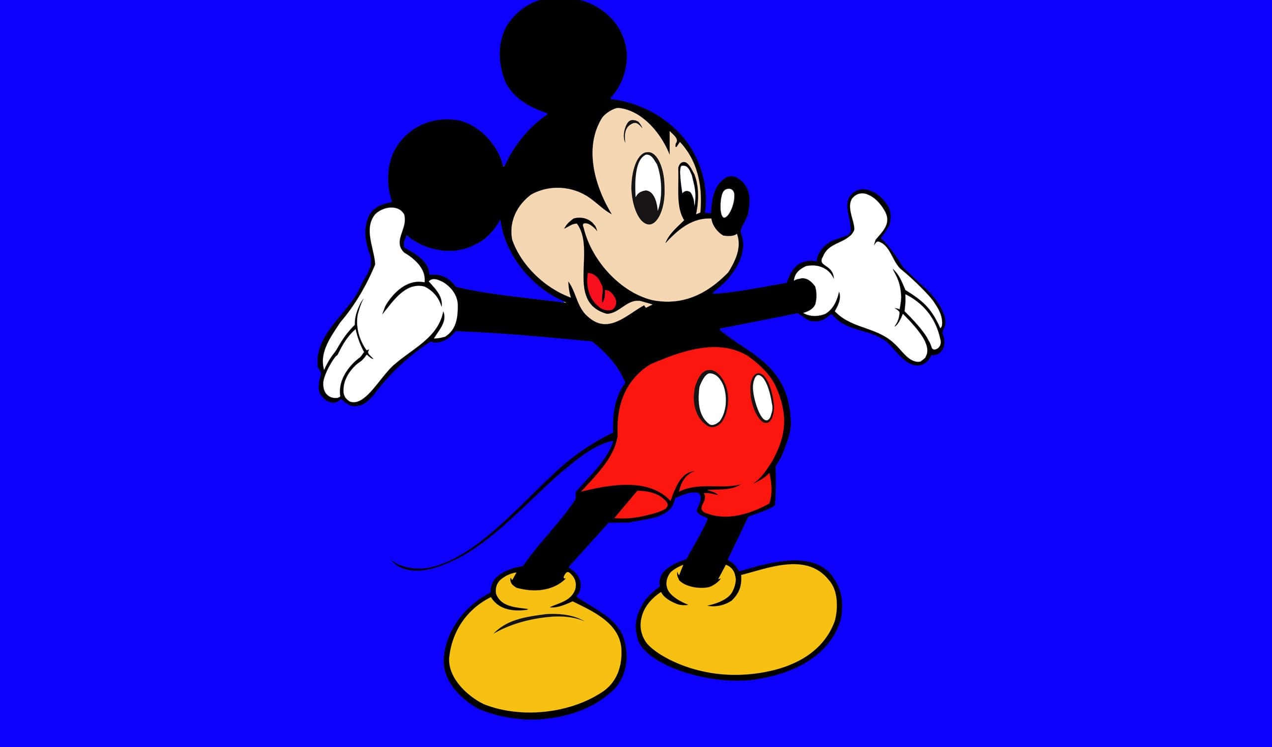 米奇 桌布 壁紙 — 經典卡通米奇老鼠在純藍色背景上微笑並熱情地做手勢。