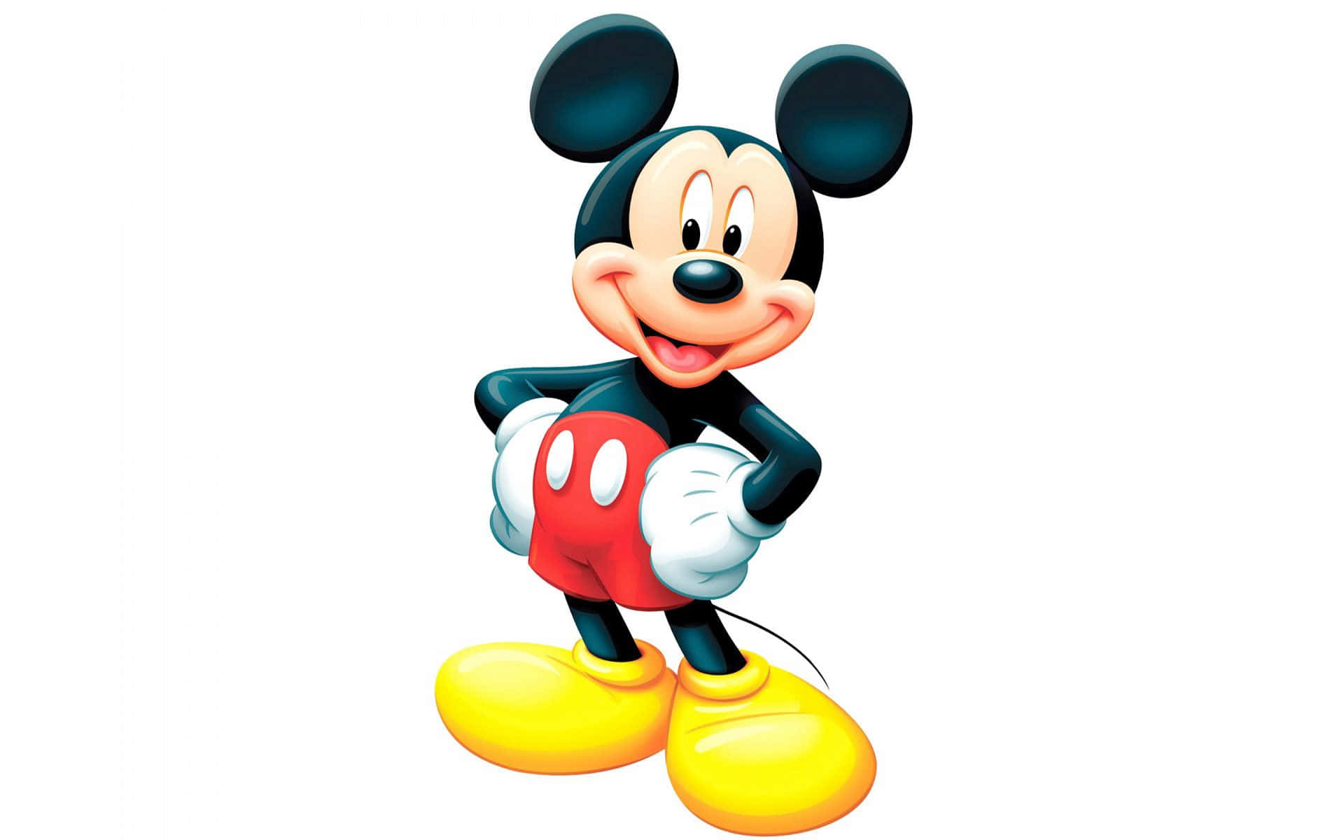 Mickey Mouse Desktop 桌布 壁紙 — 經典卡通老鼠米奇老鼠在純白色背景前，穿著其標誌性的紅色短褲和黃色鞋子，開心地微笑。
