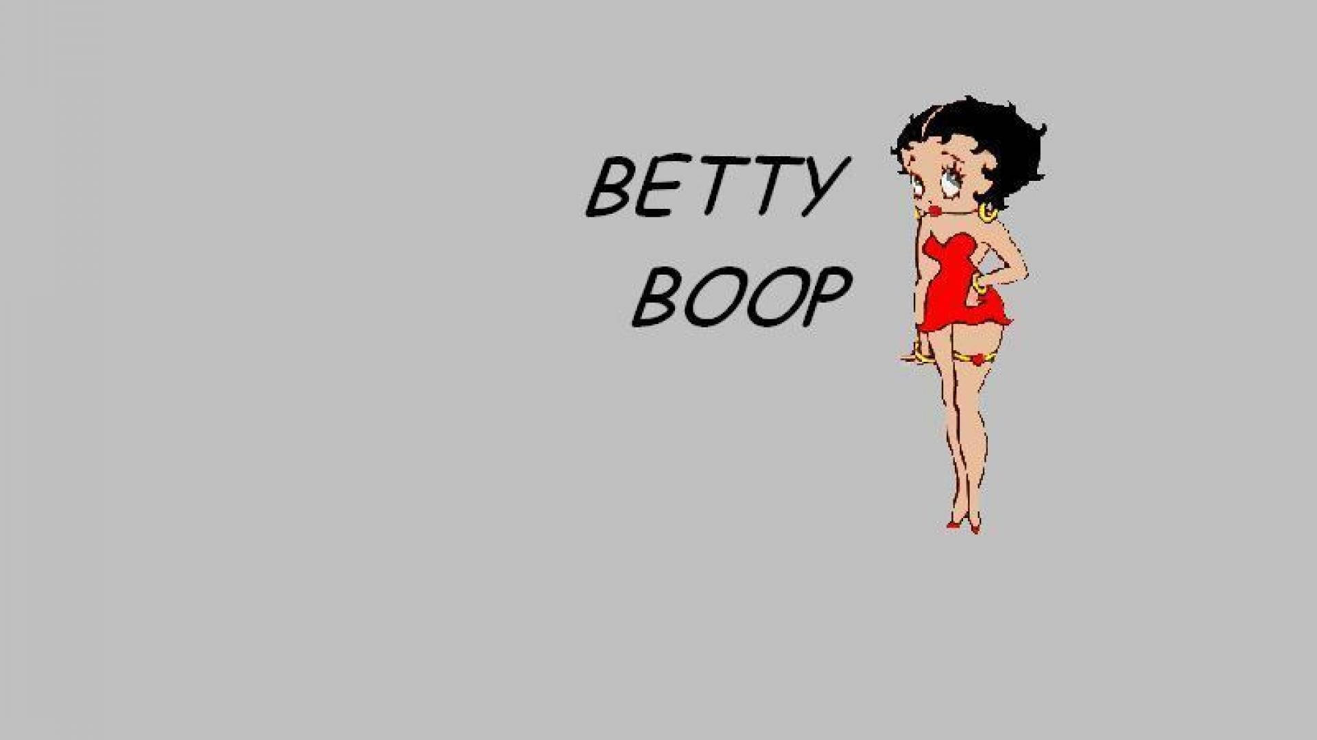 boop 桌布 壁紙 — 經典卡通角色 Betty Boop 身穿紅色連衣裙，在純灰色背景前自信地擺姿勢，旁邊寫有她的名字。