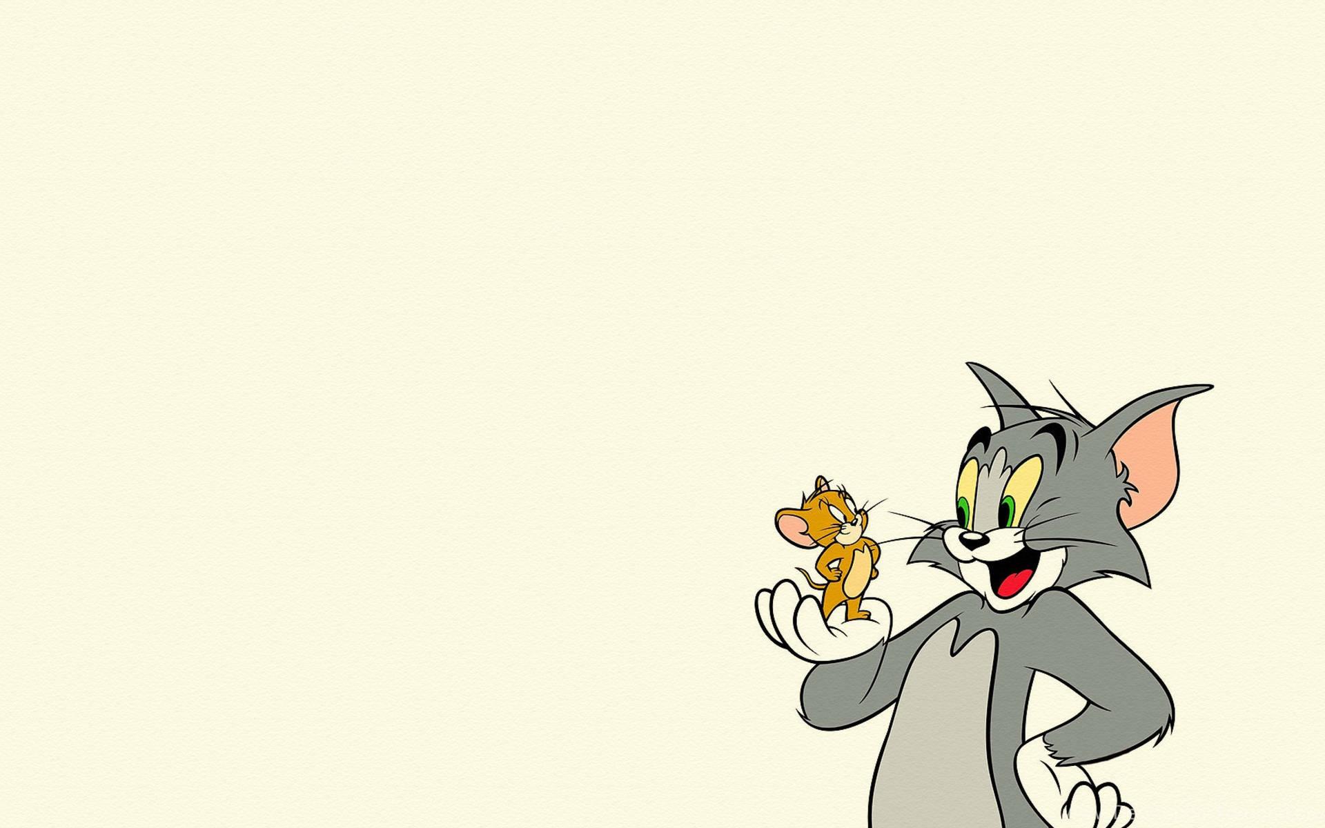 貓 Tom 帶著開心的表情，輕輕地將老鼠 Jerry 捧在掌心。 — 湯姆與傑利 GIF 壁紙